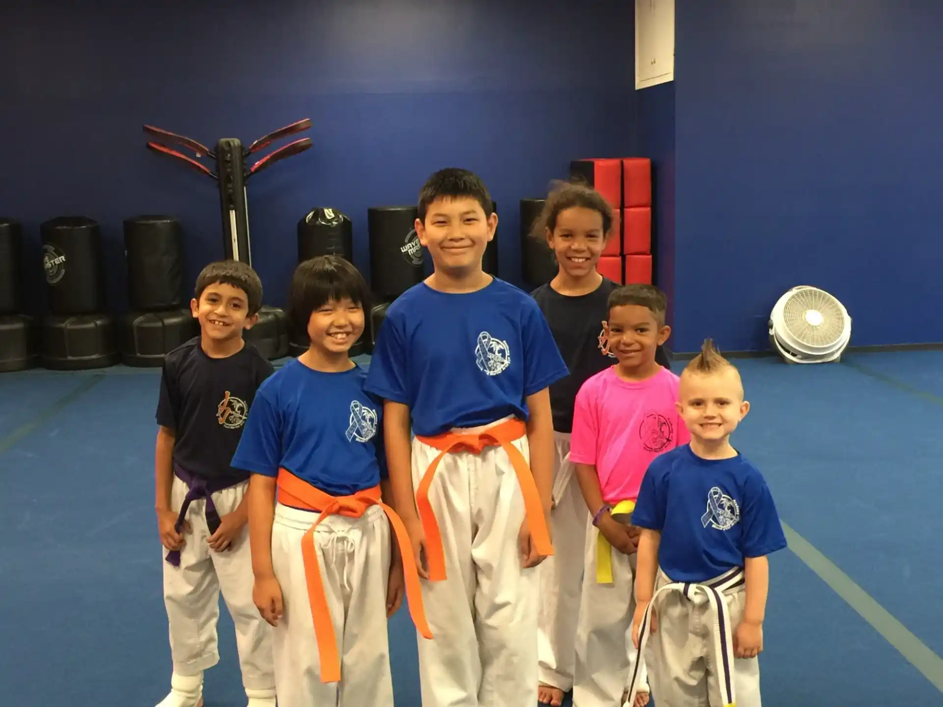a group of kids posing for a photo