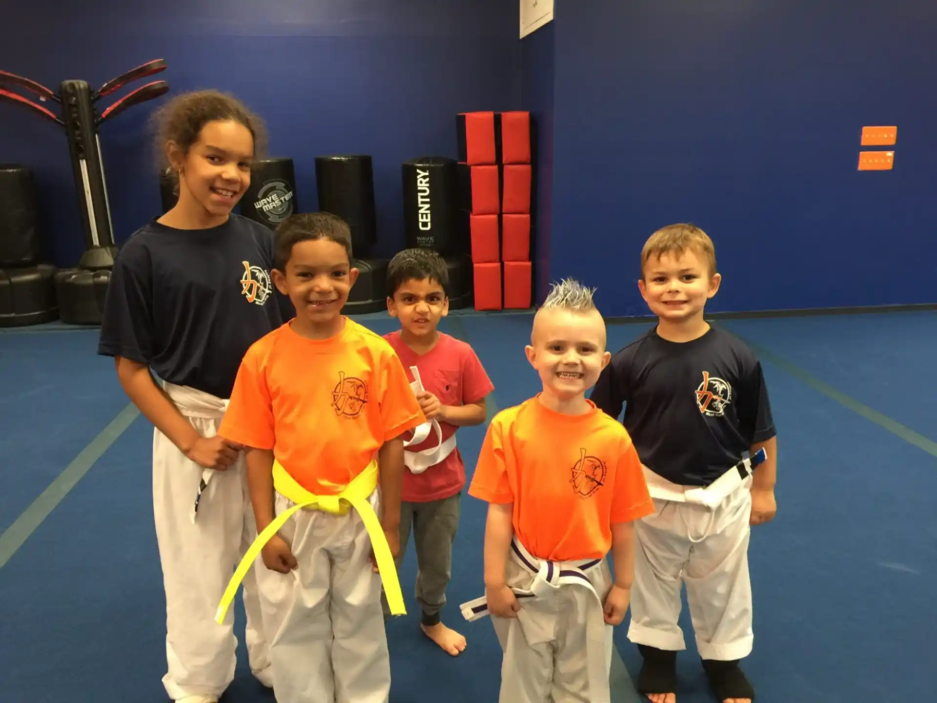 a group of kids posing for a photo