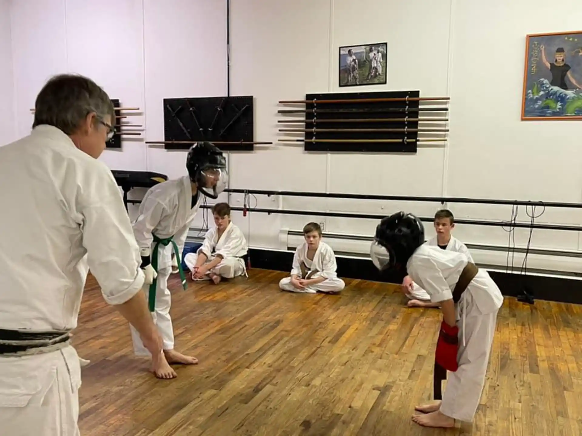 a group of people in karate uniforms