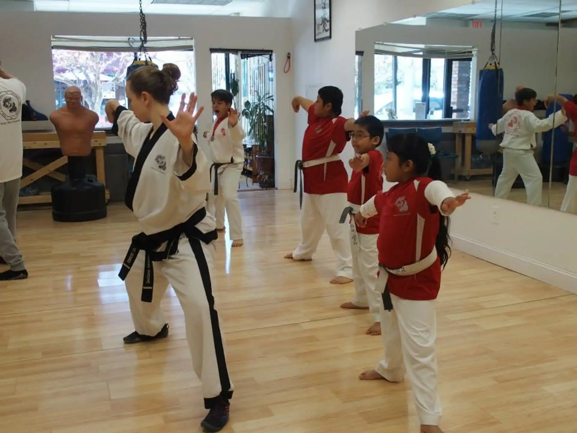 a group of people in karate uniforms
