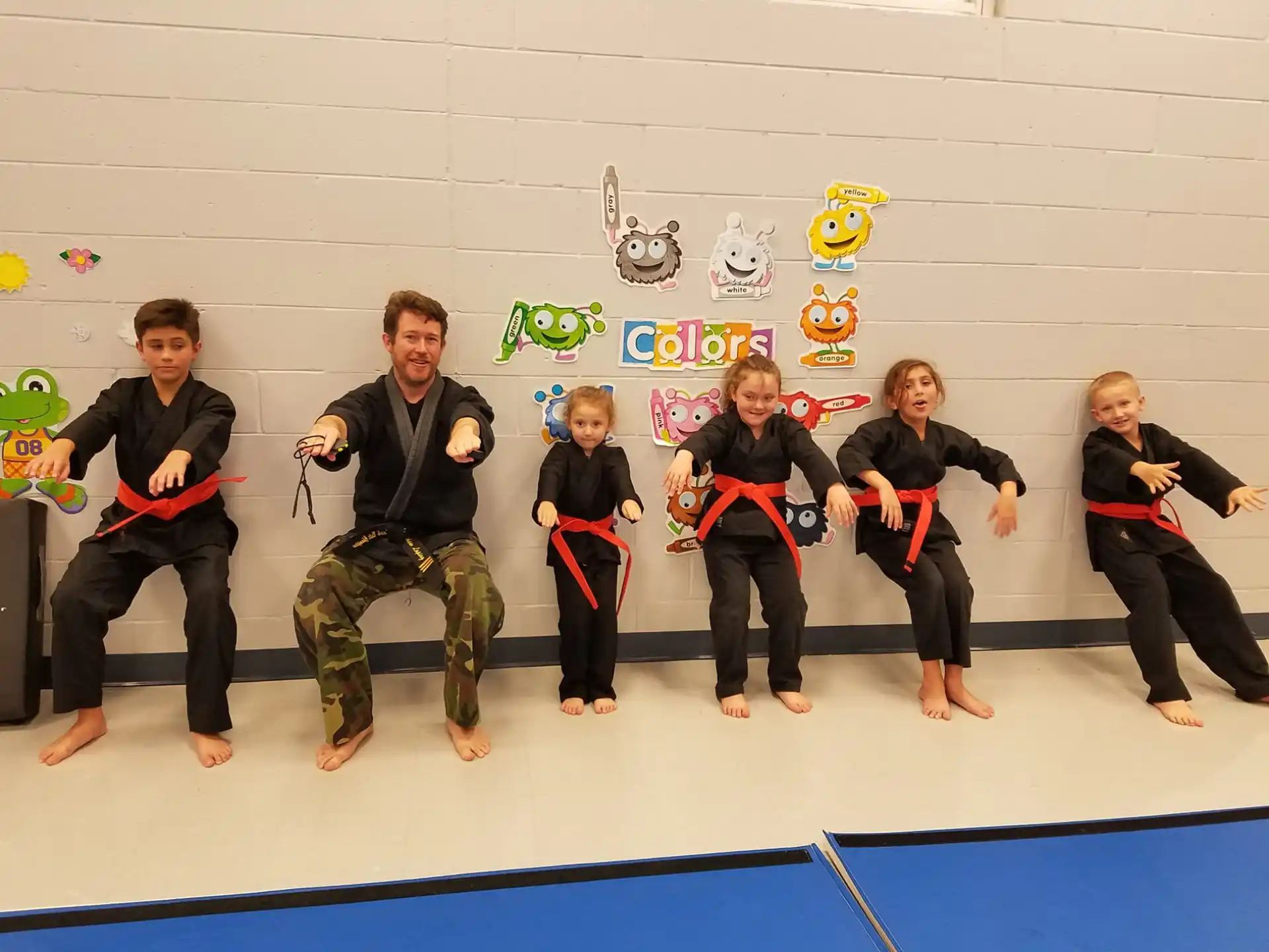 a group of people in martial arts uniforms