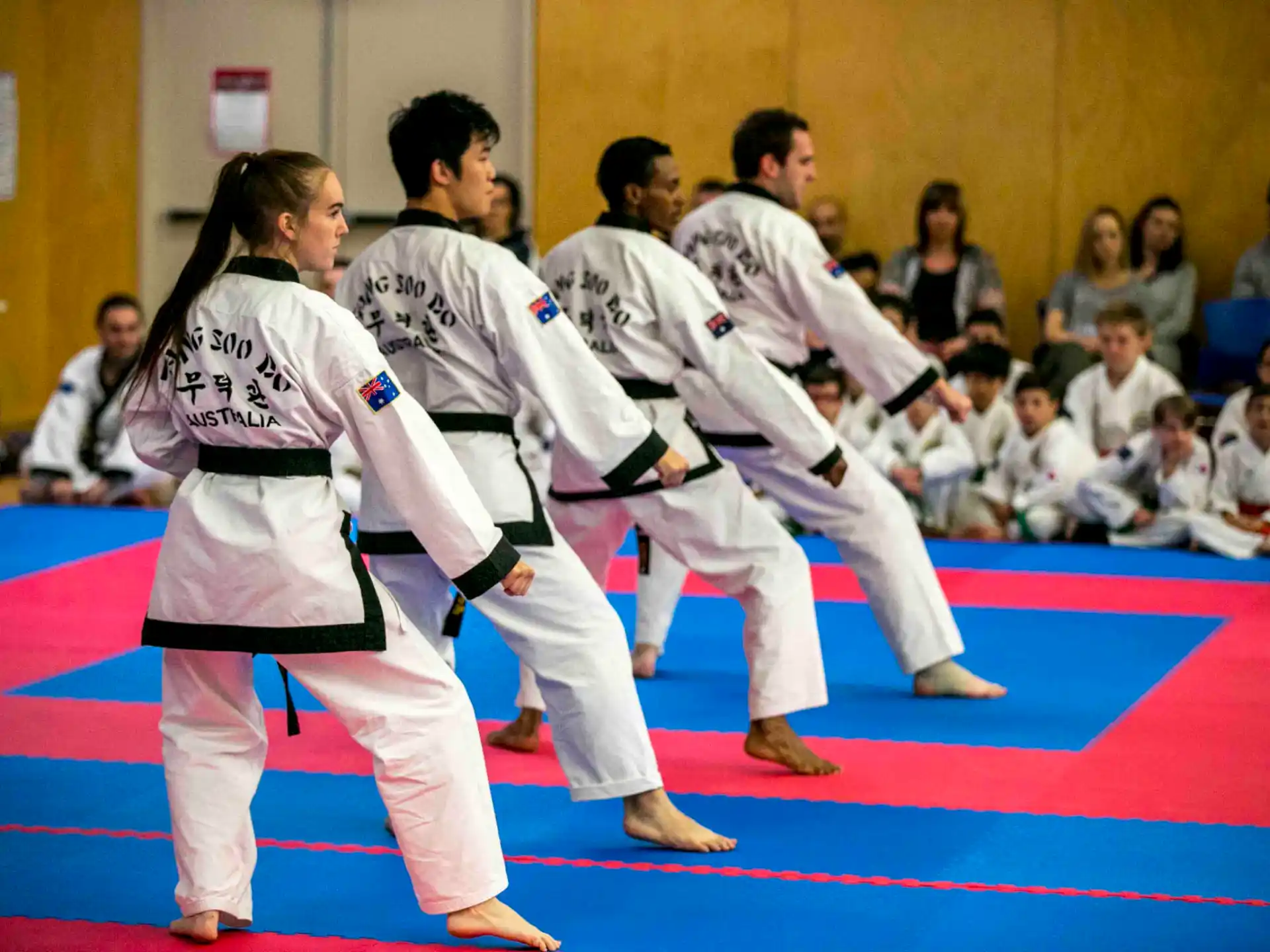 a group of people in karate uniforms