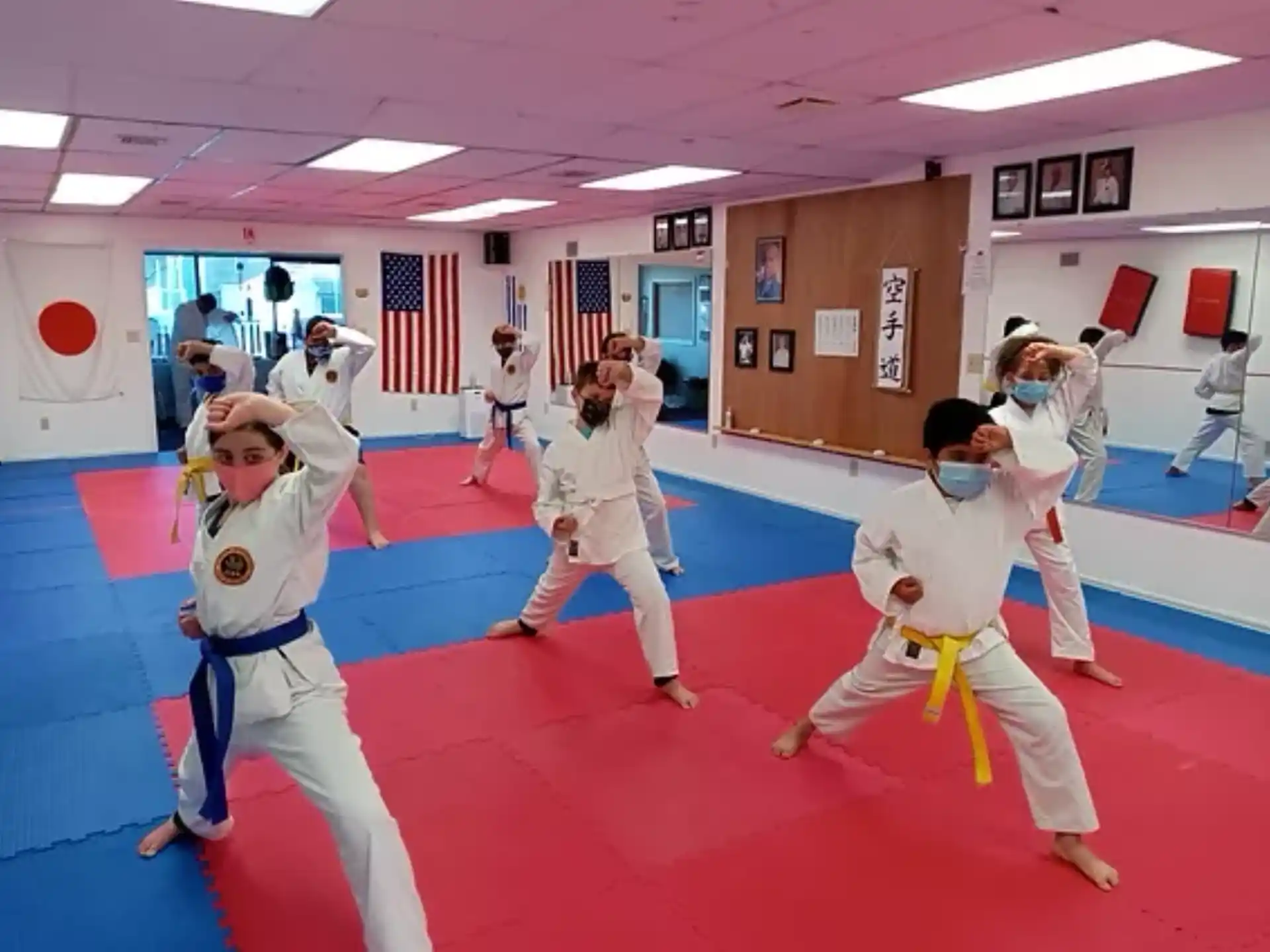 a group of people in karate uniforms