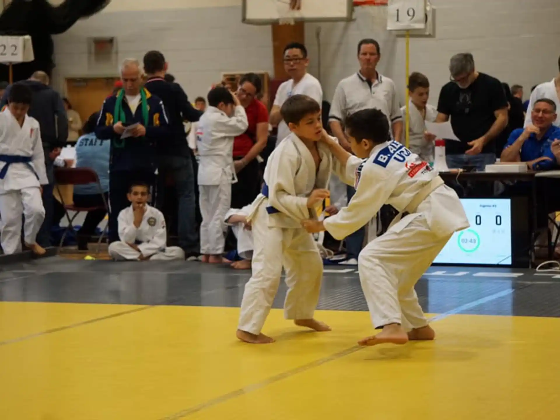 a group of people in karate uniforms