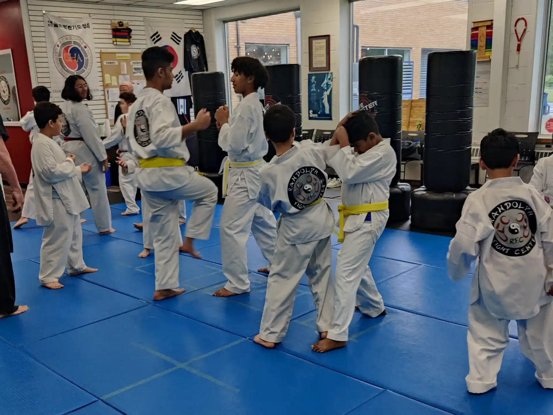 a group of people in karate uniforms