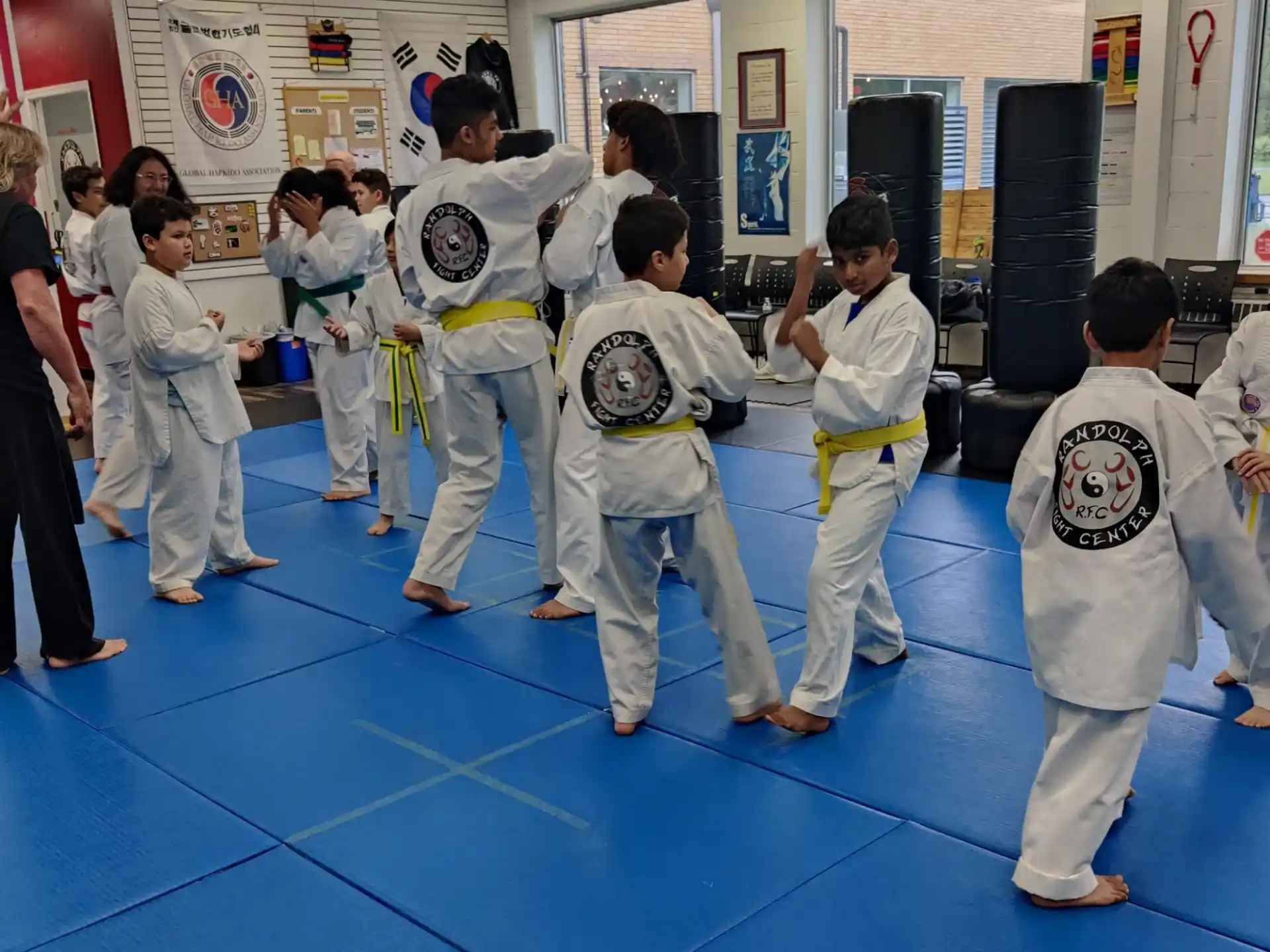 a group of people in karate uniforms