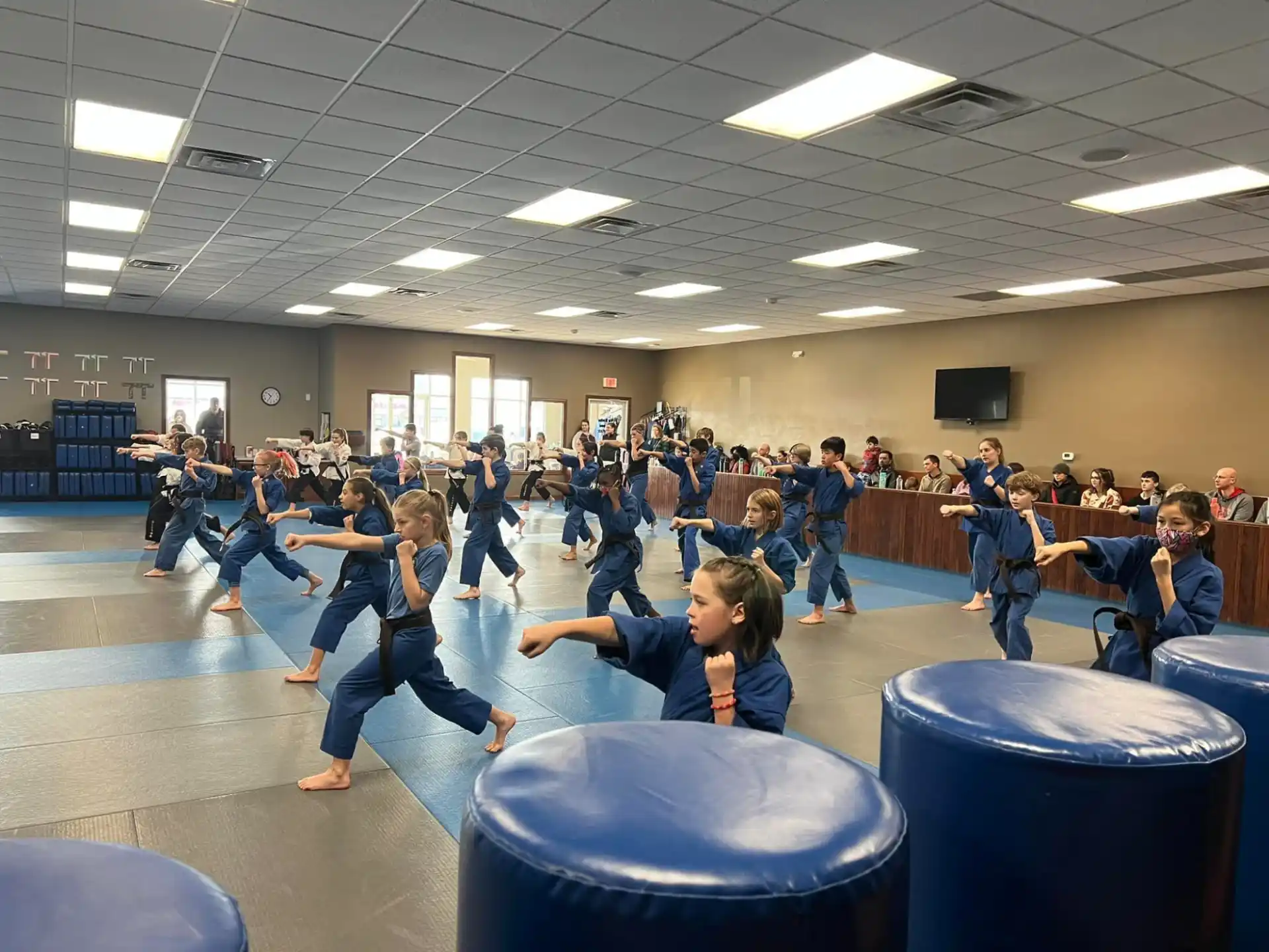 a group of people exercising in a room