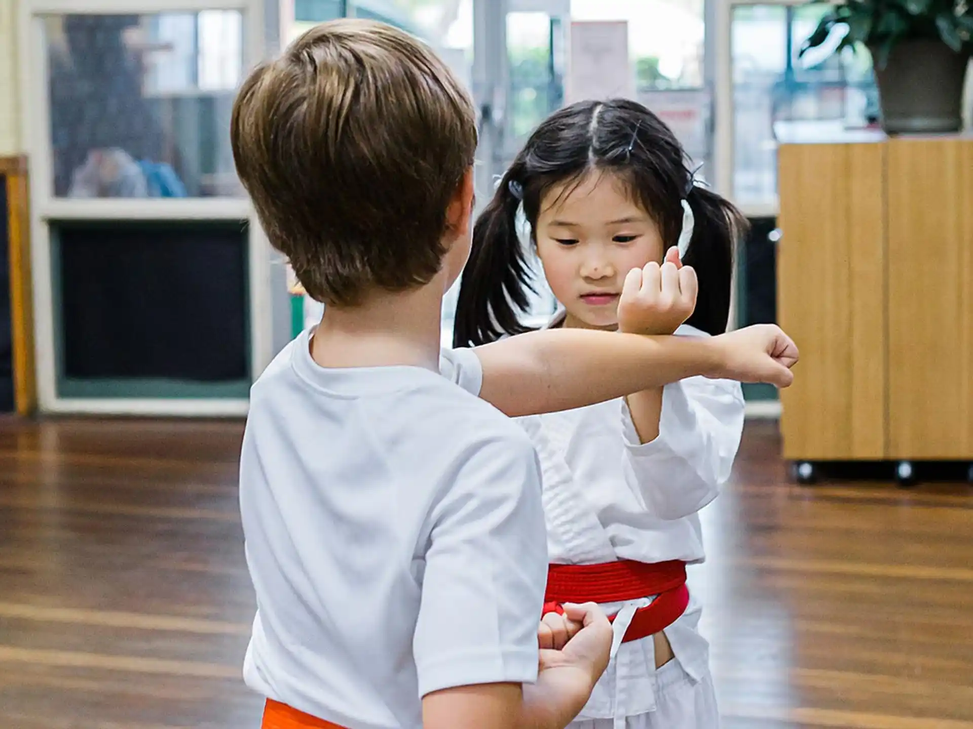 a boy and girl holding each other