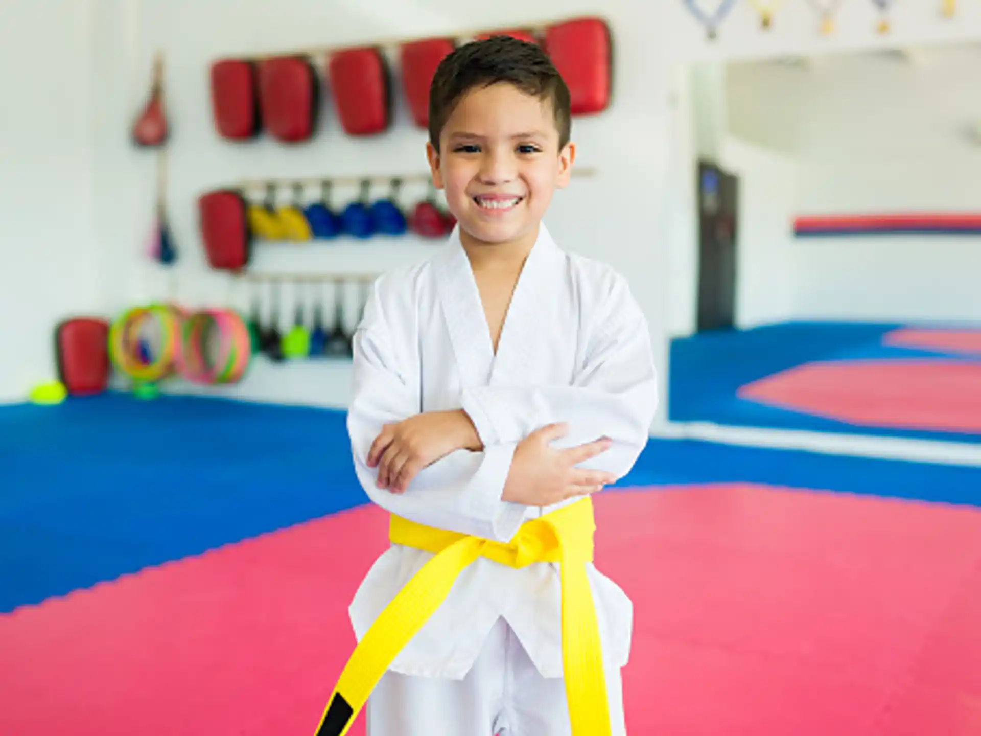 a boy in a karate uniform