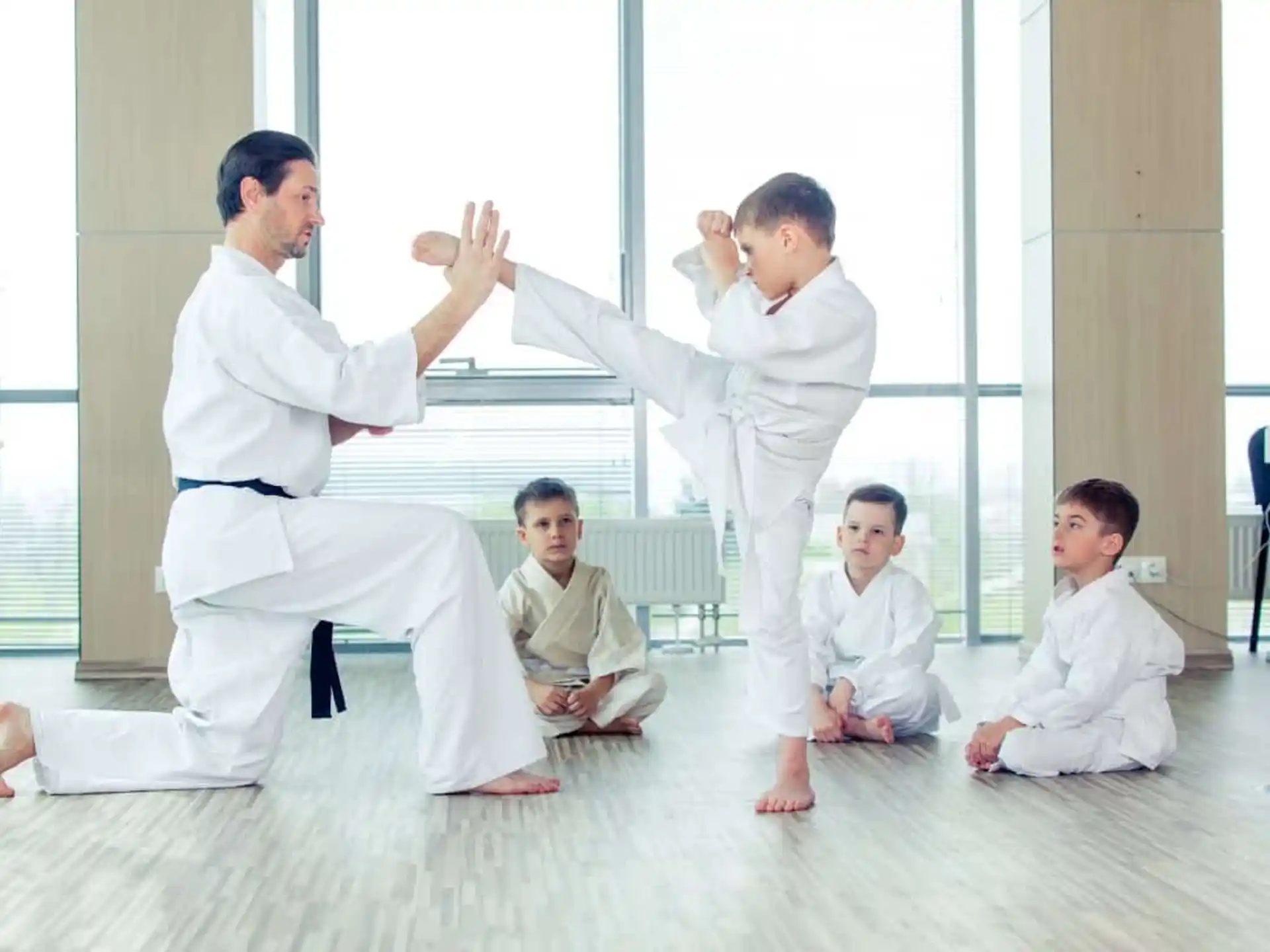 a group of people in karate uniforms