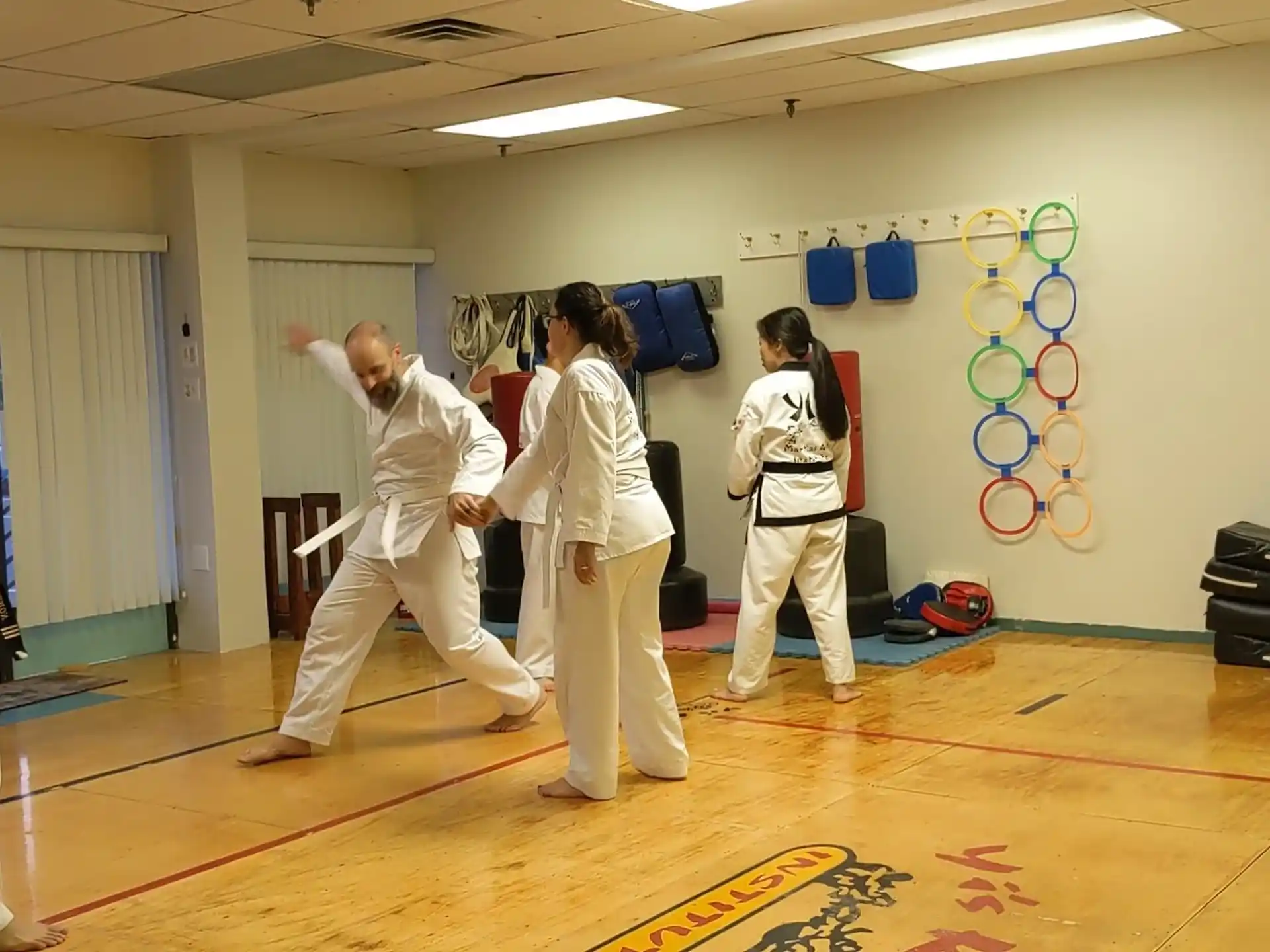 a group of people in karate uniforms