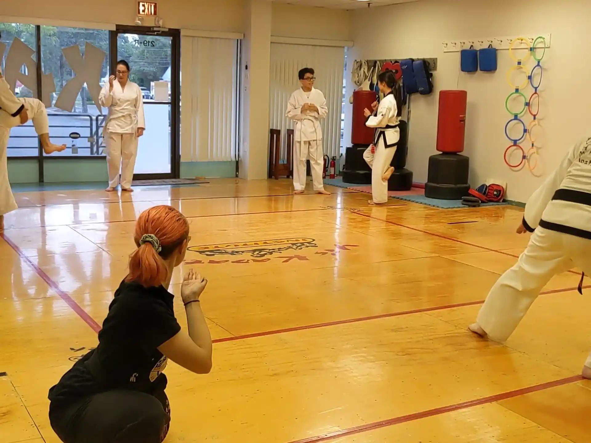 a group of people in karate uniforms