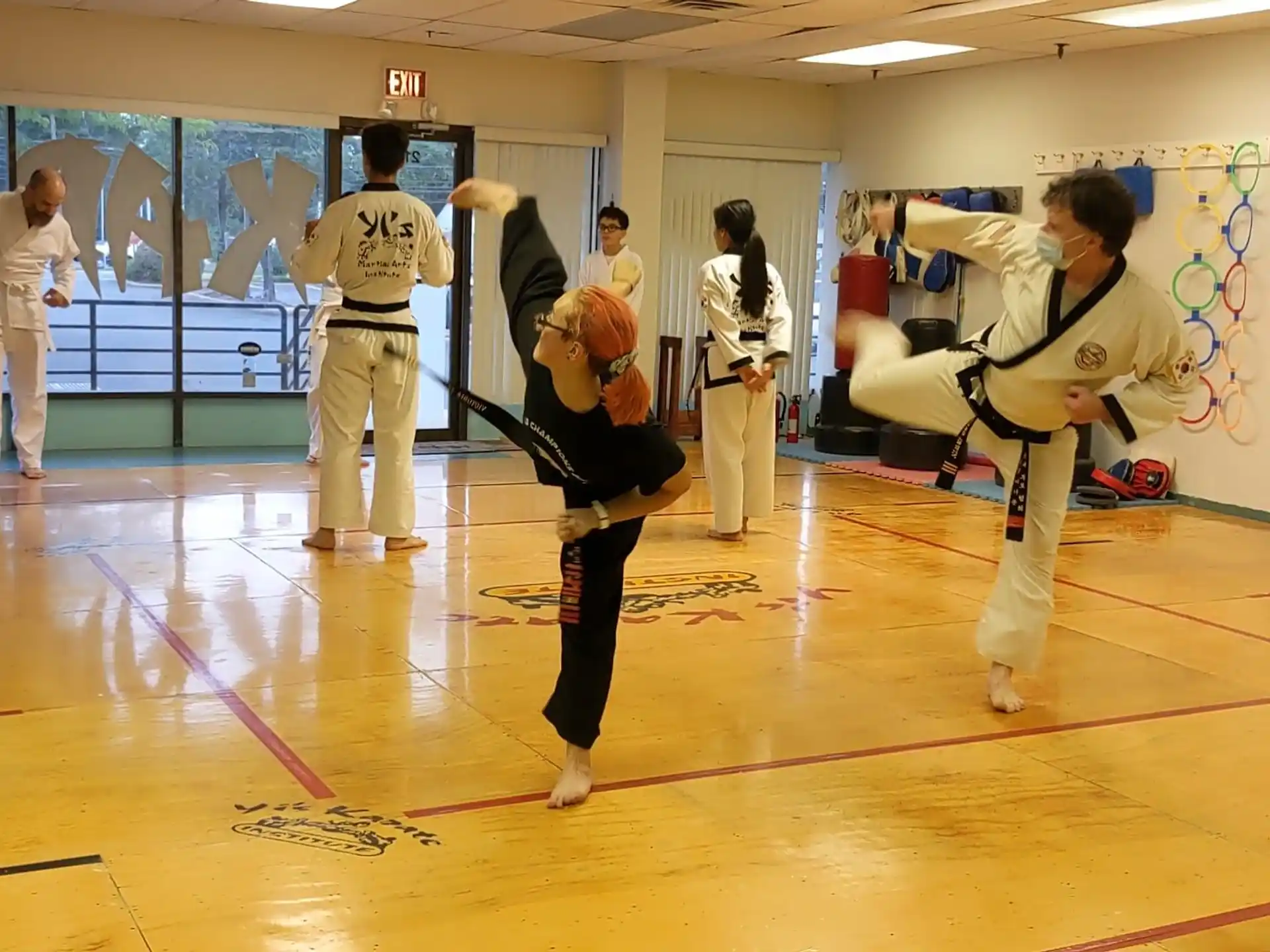 a group of people in karate uniforms