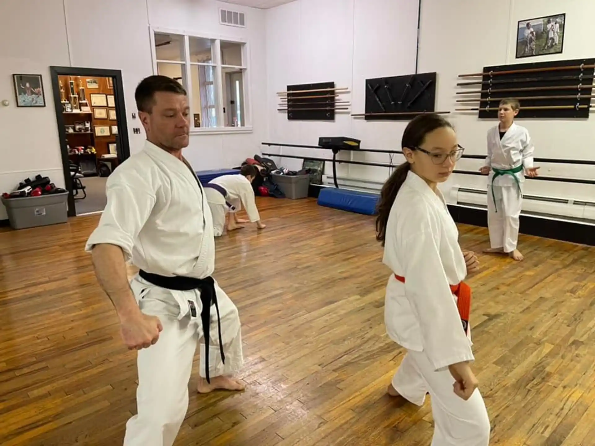 a man and a woman in karate uniforms