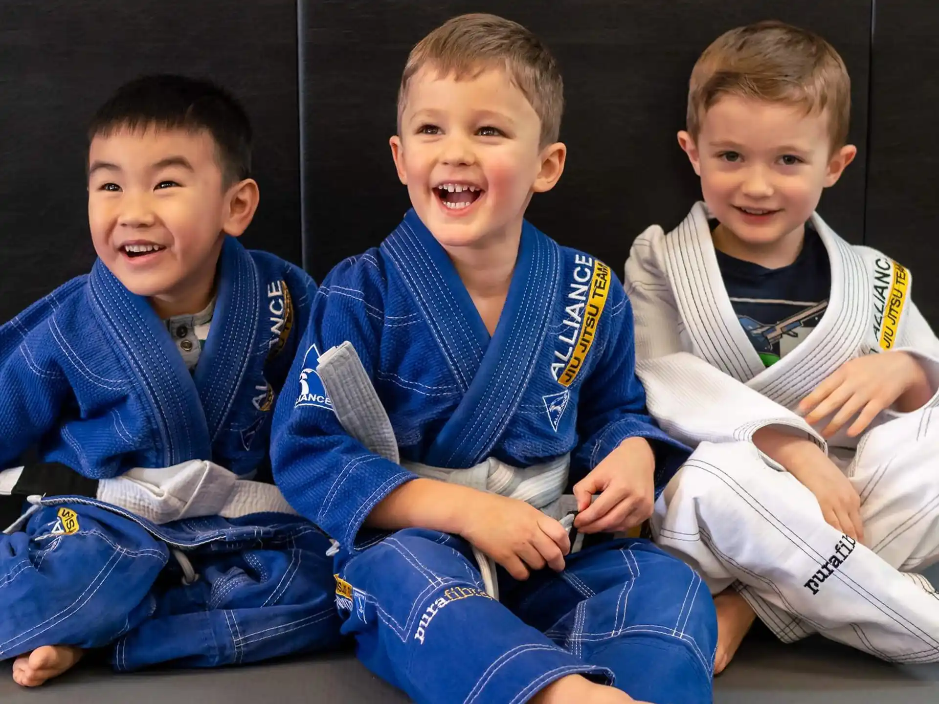 a group of boys sitting on the floor