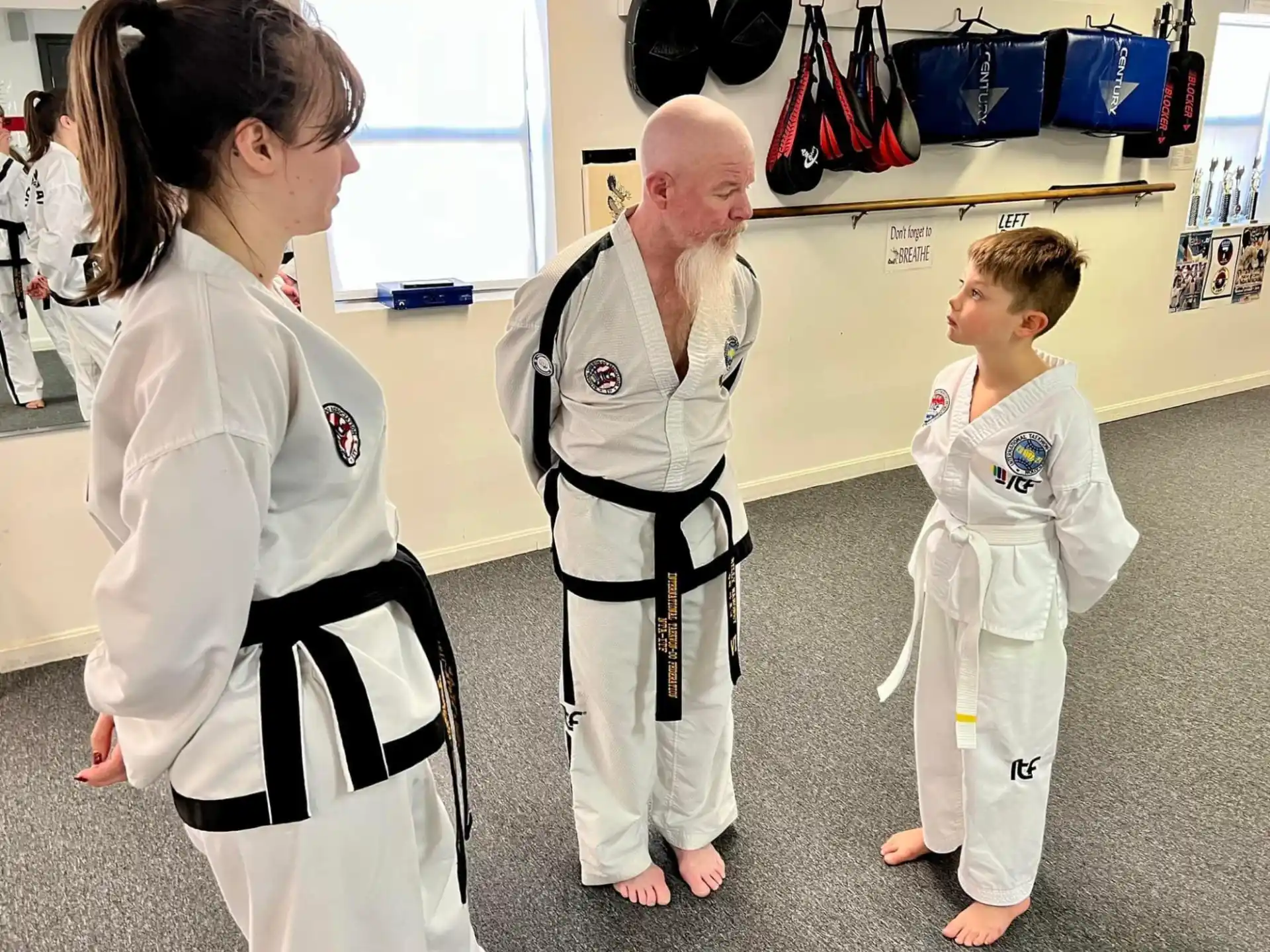 a man and a woman in karate uniforms