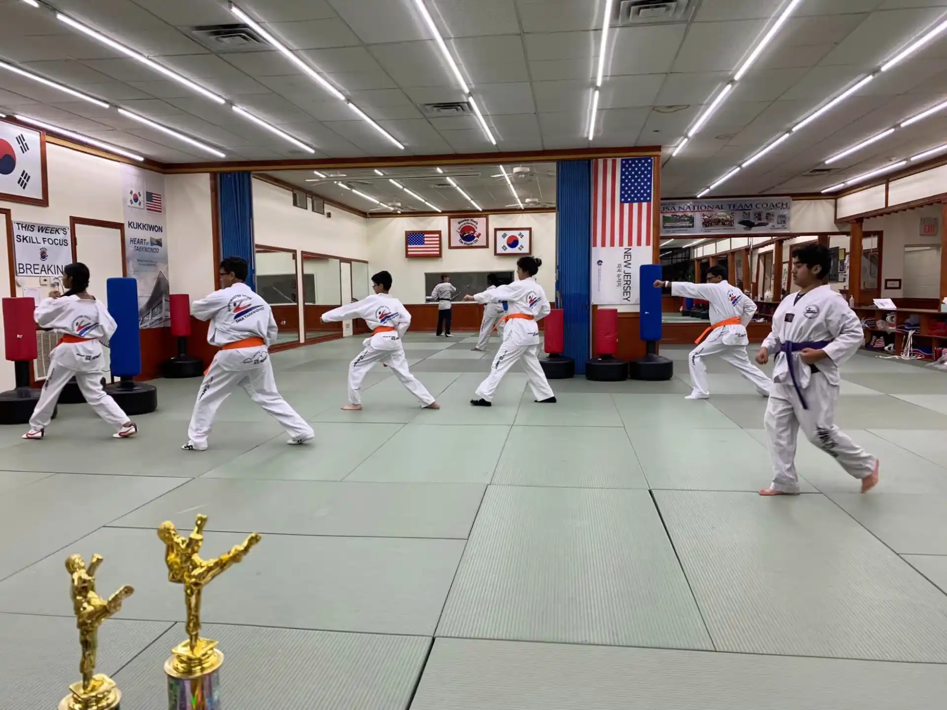 a group of people in karate uniforms