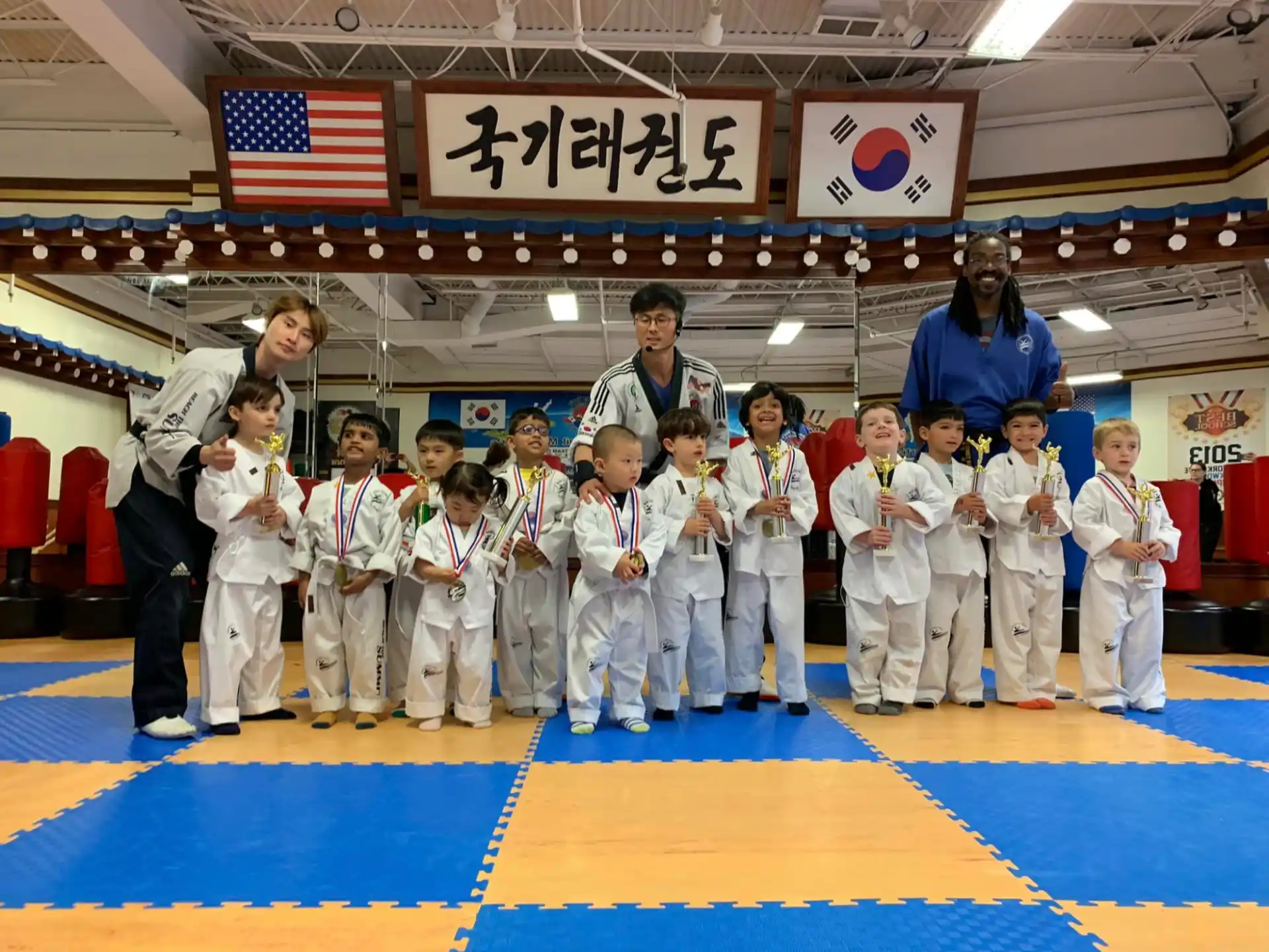 a group of people in karate uniforms