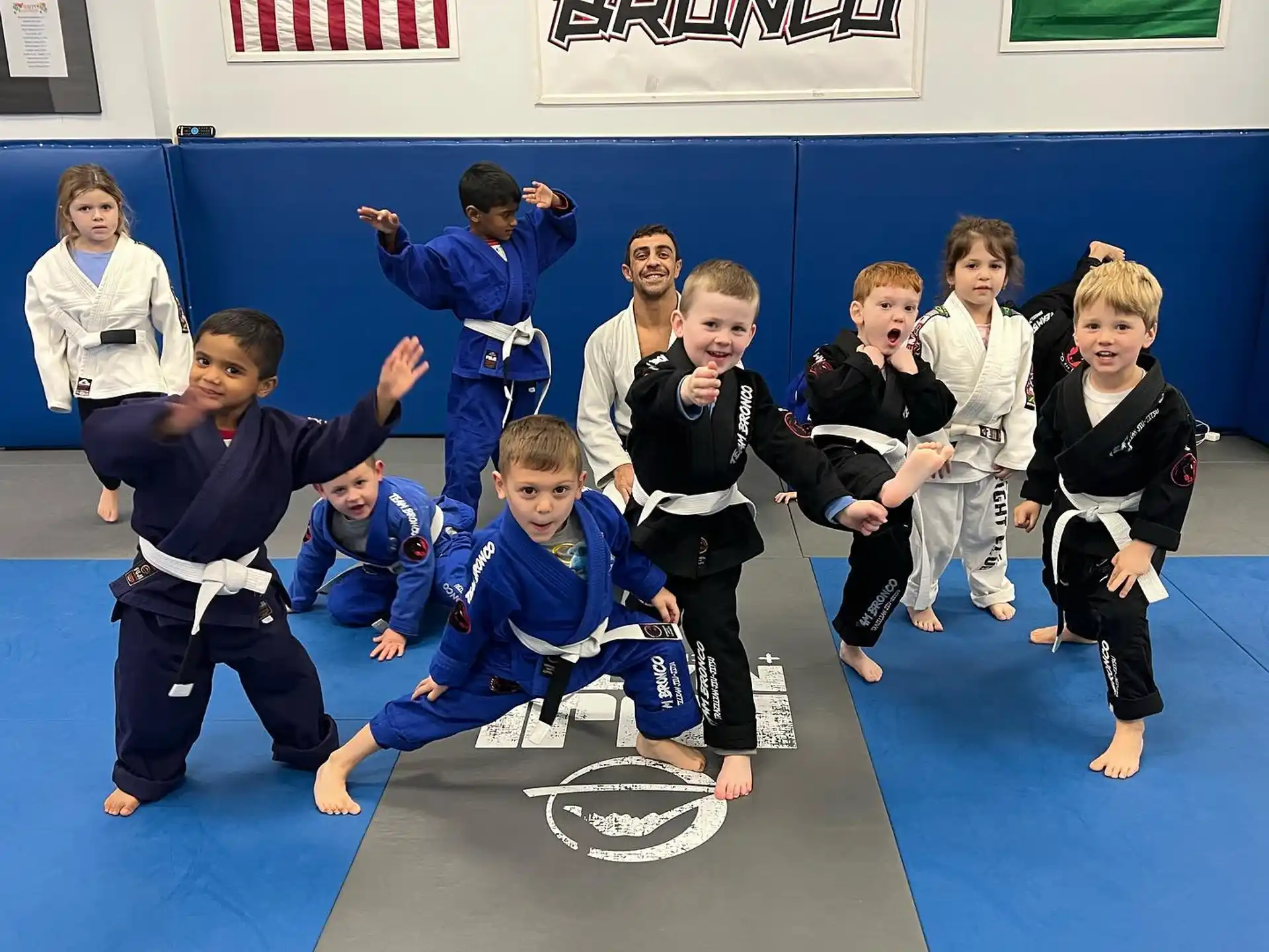 a group of children in karate uniforms