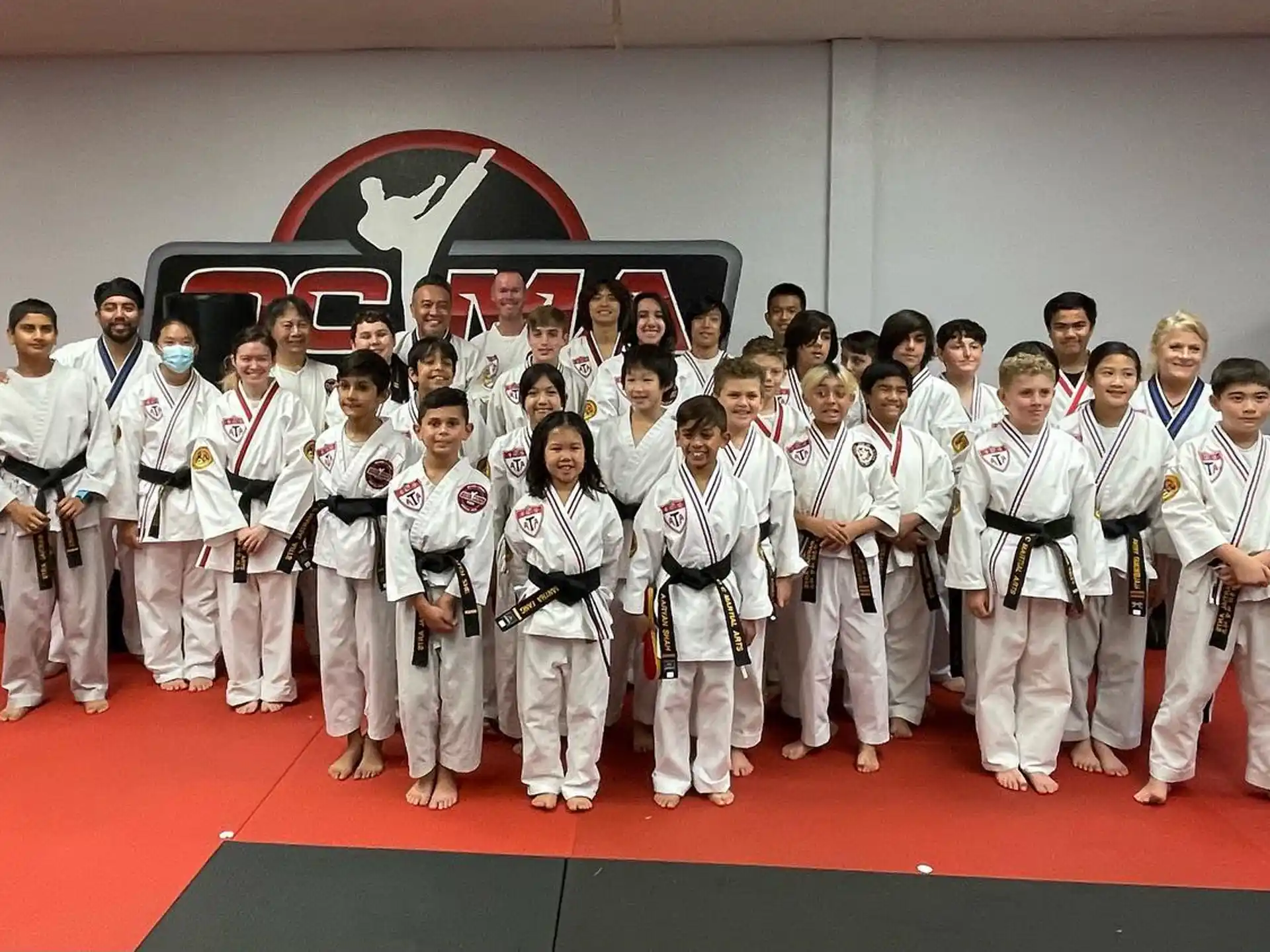 a group of people in karate uniforms