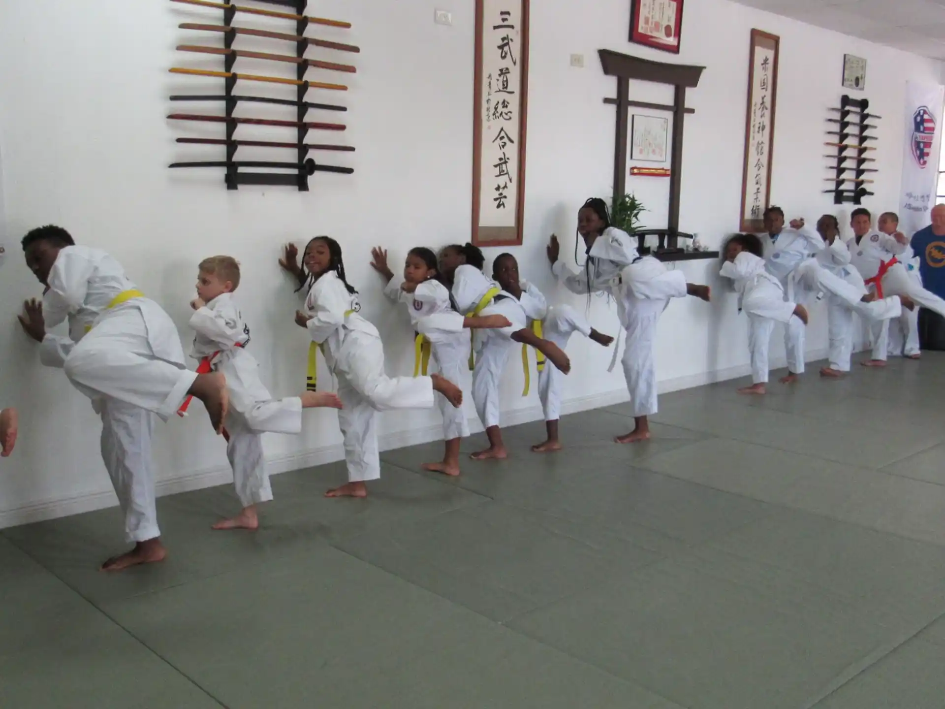 a group of people in karate uniforms