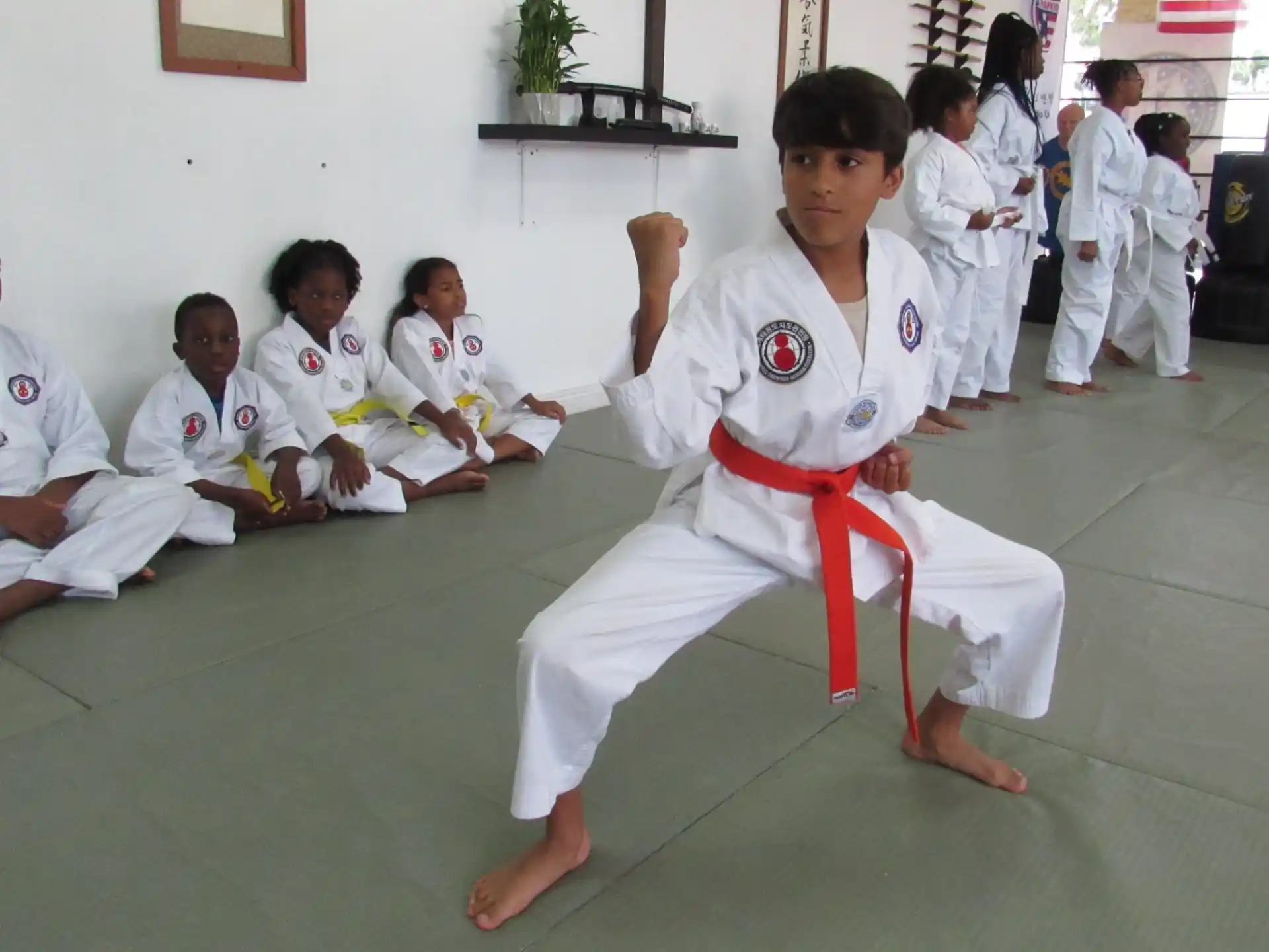 a group of people in karate uniforms