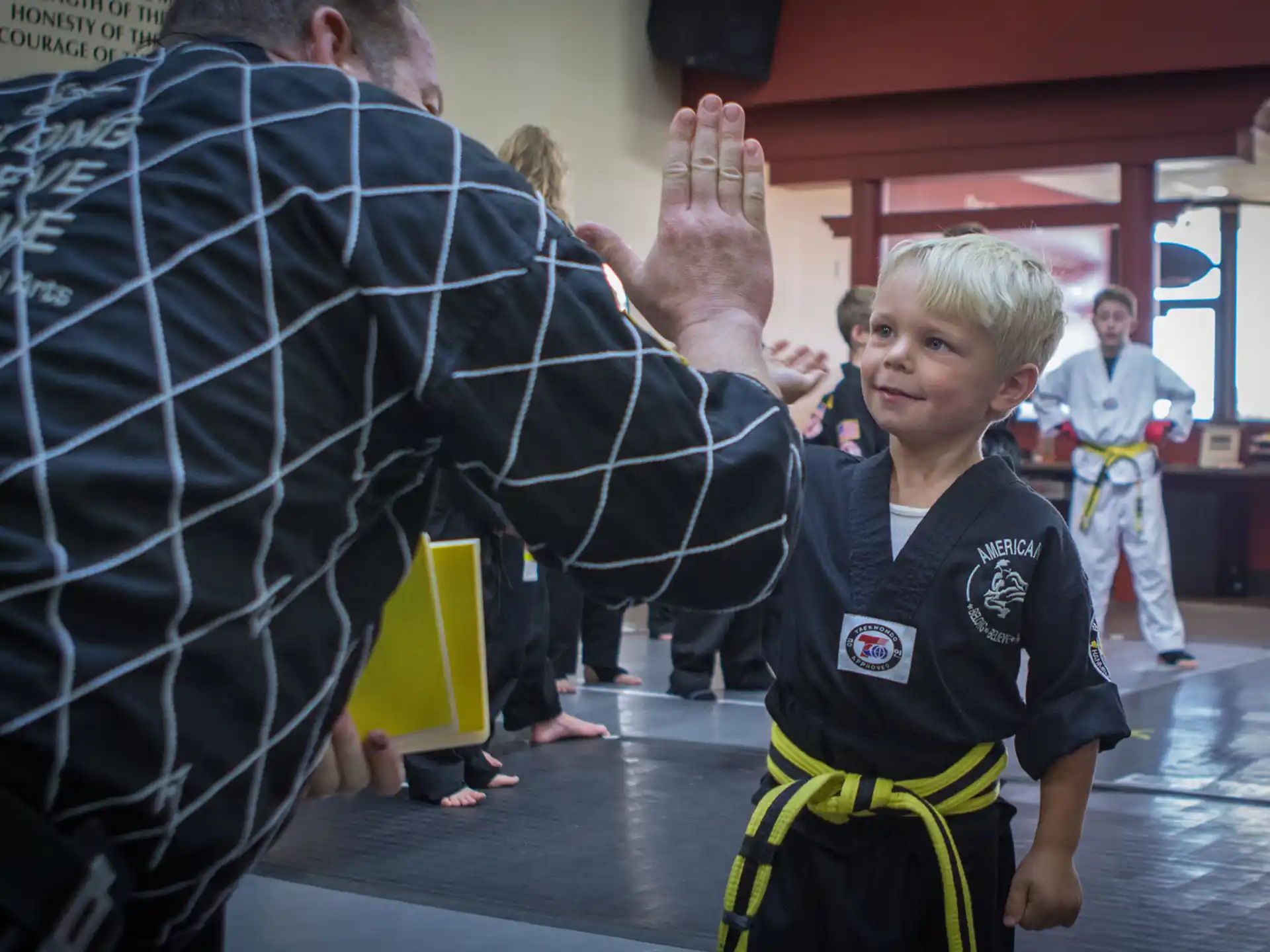 a boy in a karate uniform