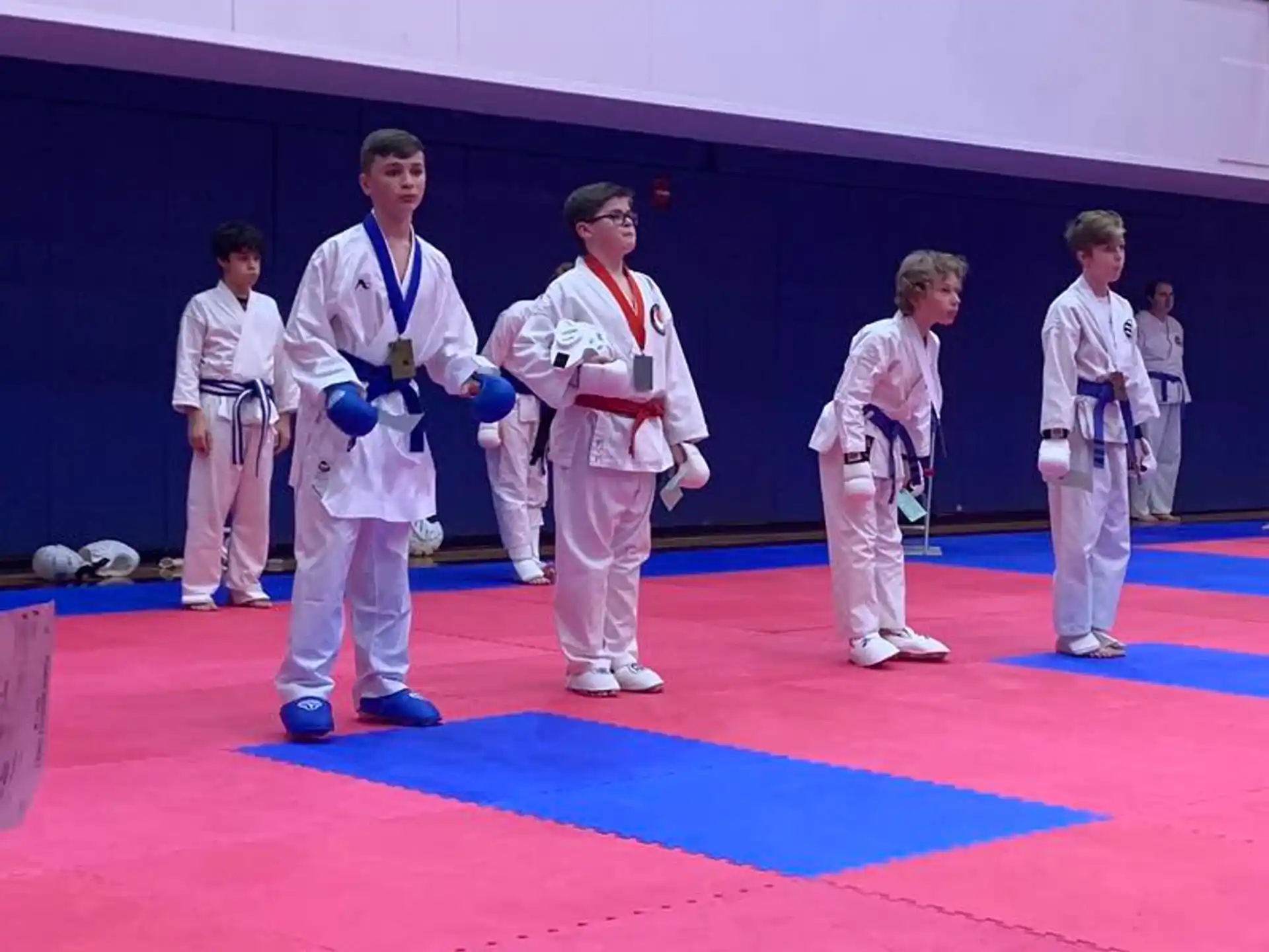 a group of people in karate uniforms