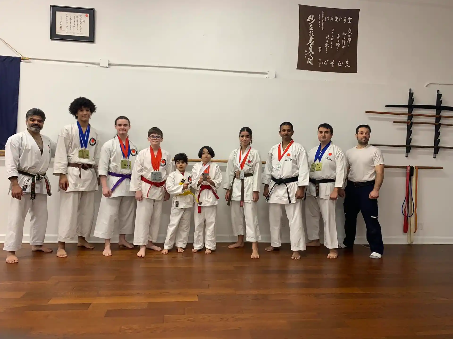 a group of people in karate uniforms