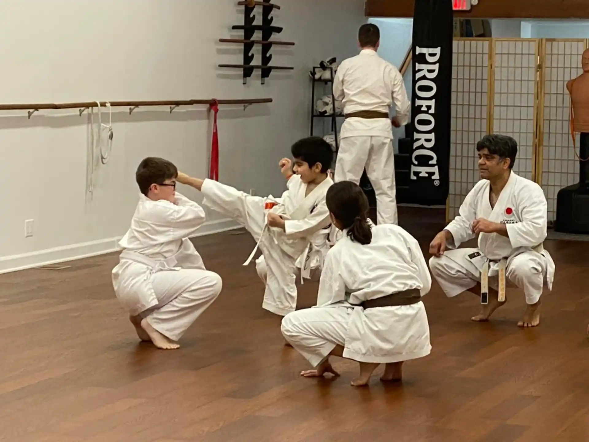 a group of people in karate uniforms