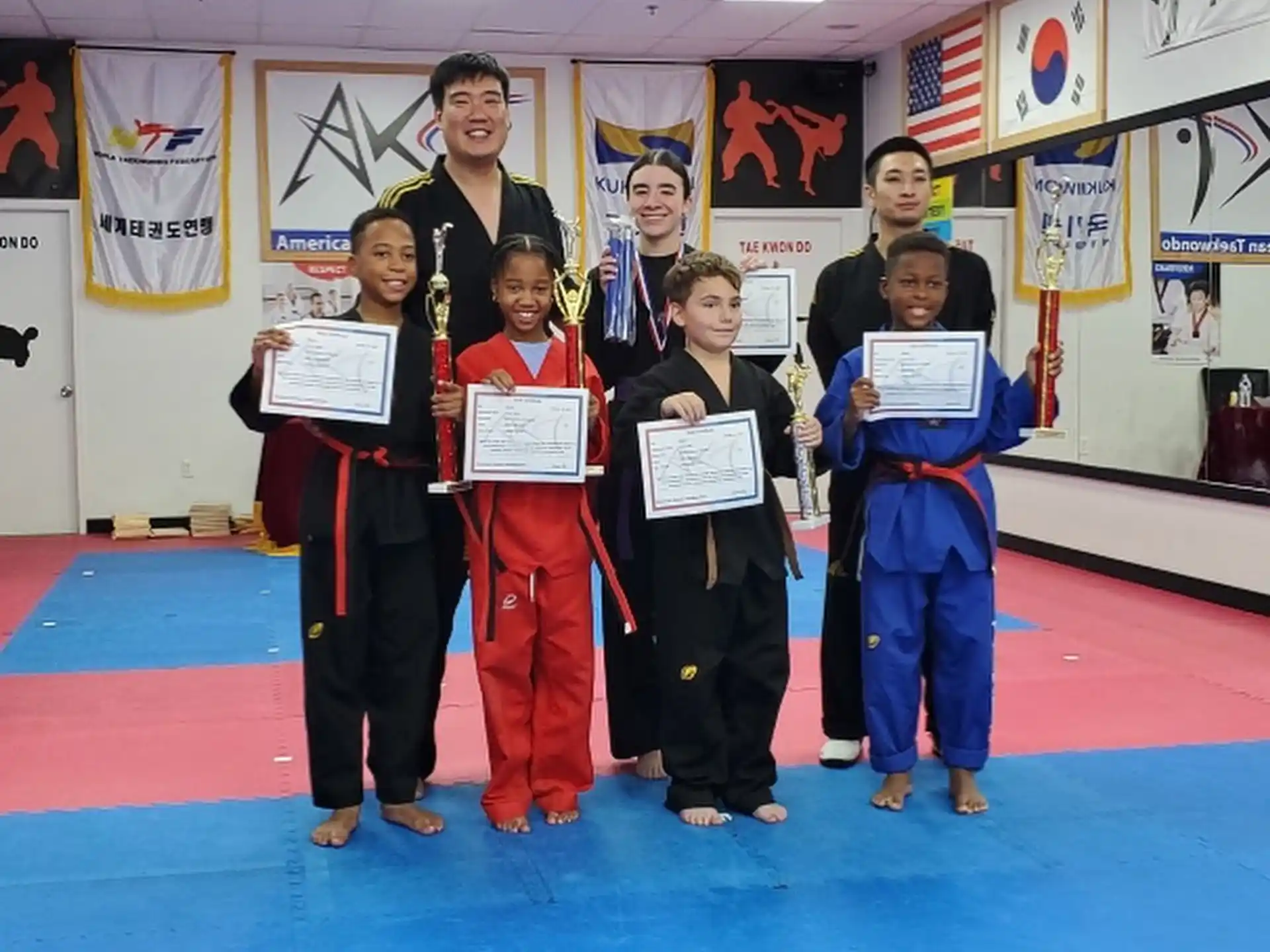 a group of children holding certificates