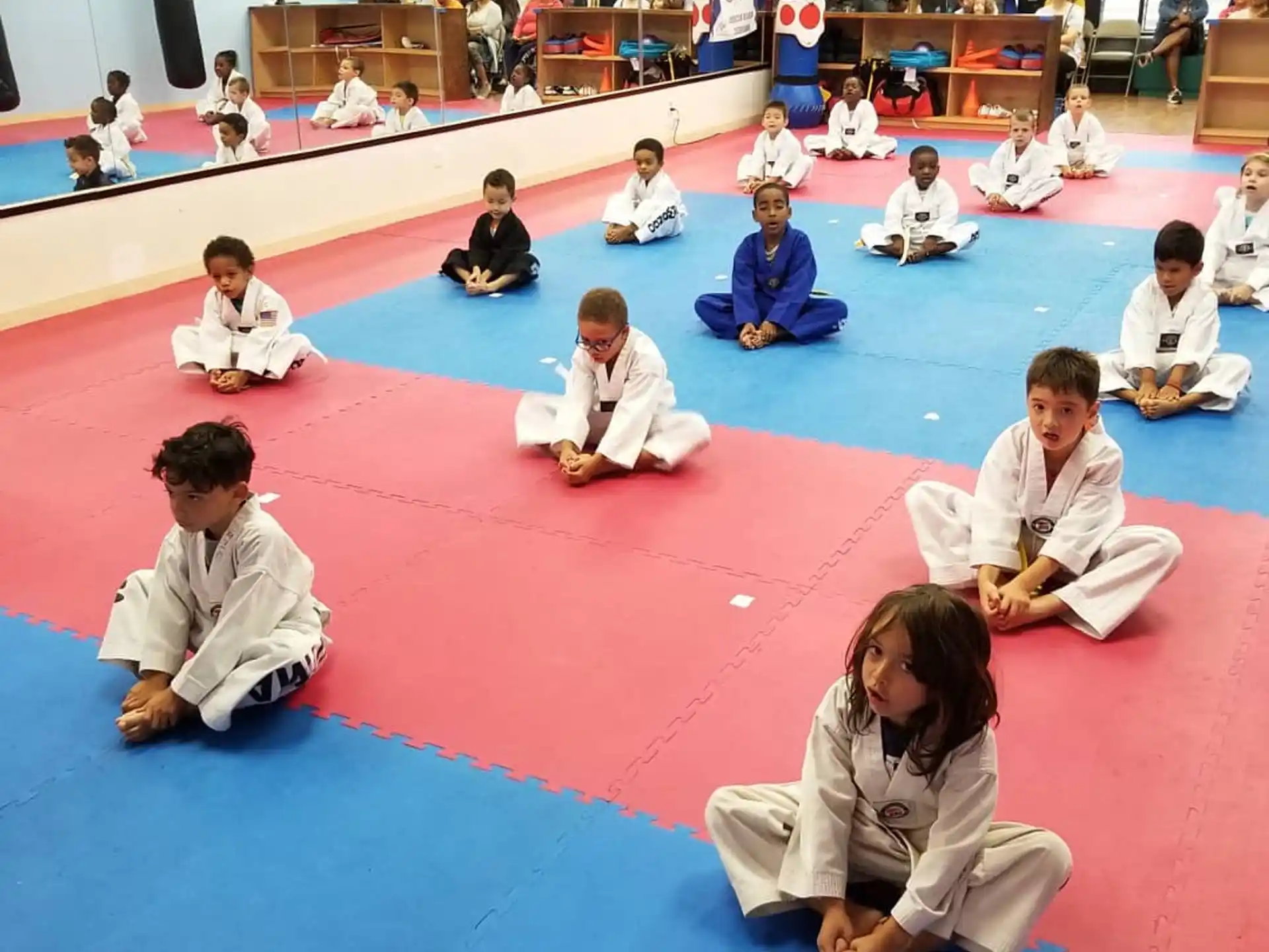 a group of people sitting on the floor