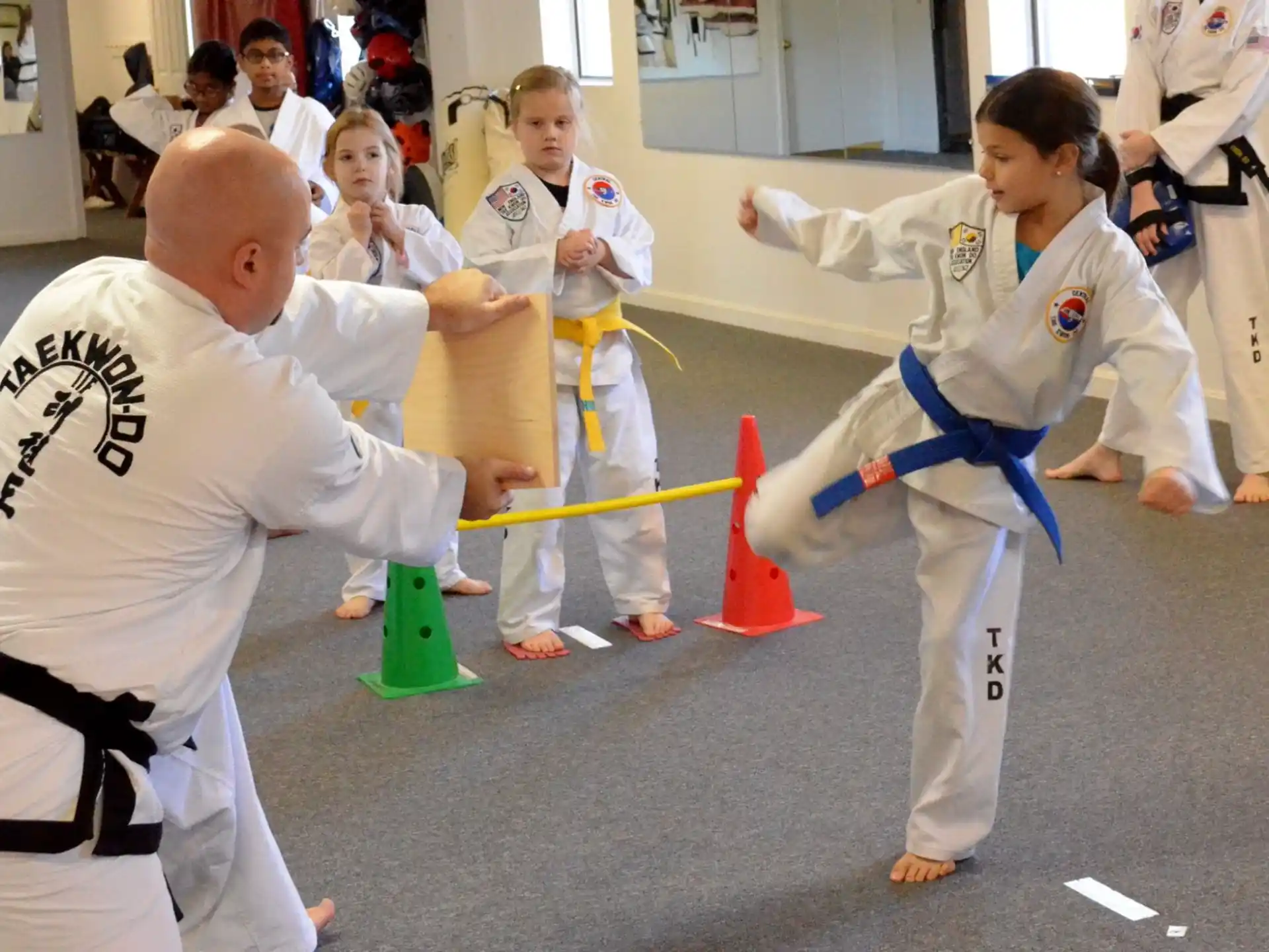 a group of people in karate uniforms