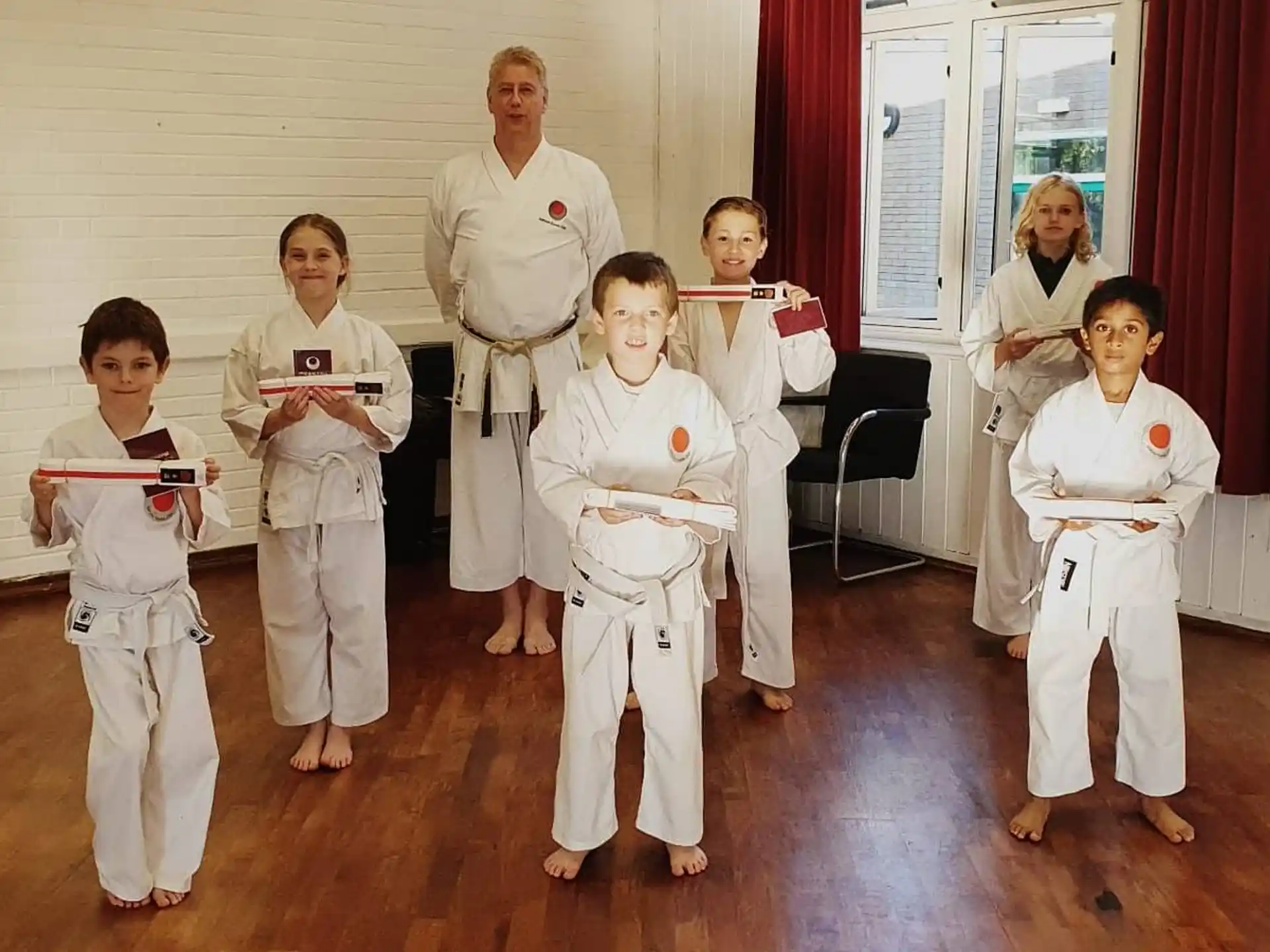 a group of people in karate uniforms