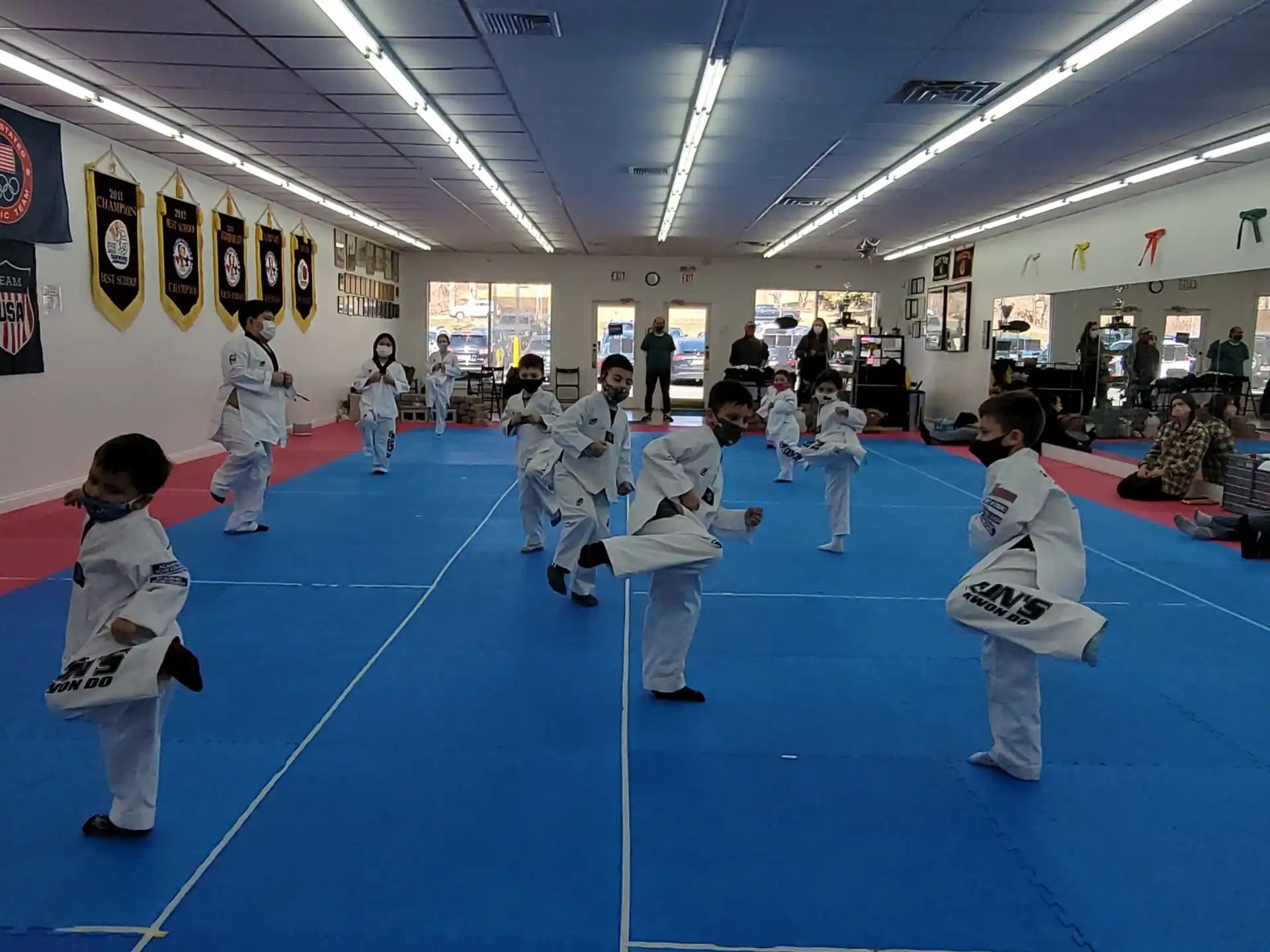 a group of people in karate uniforms