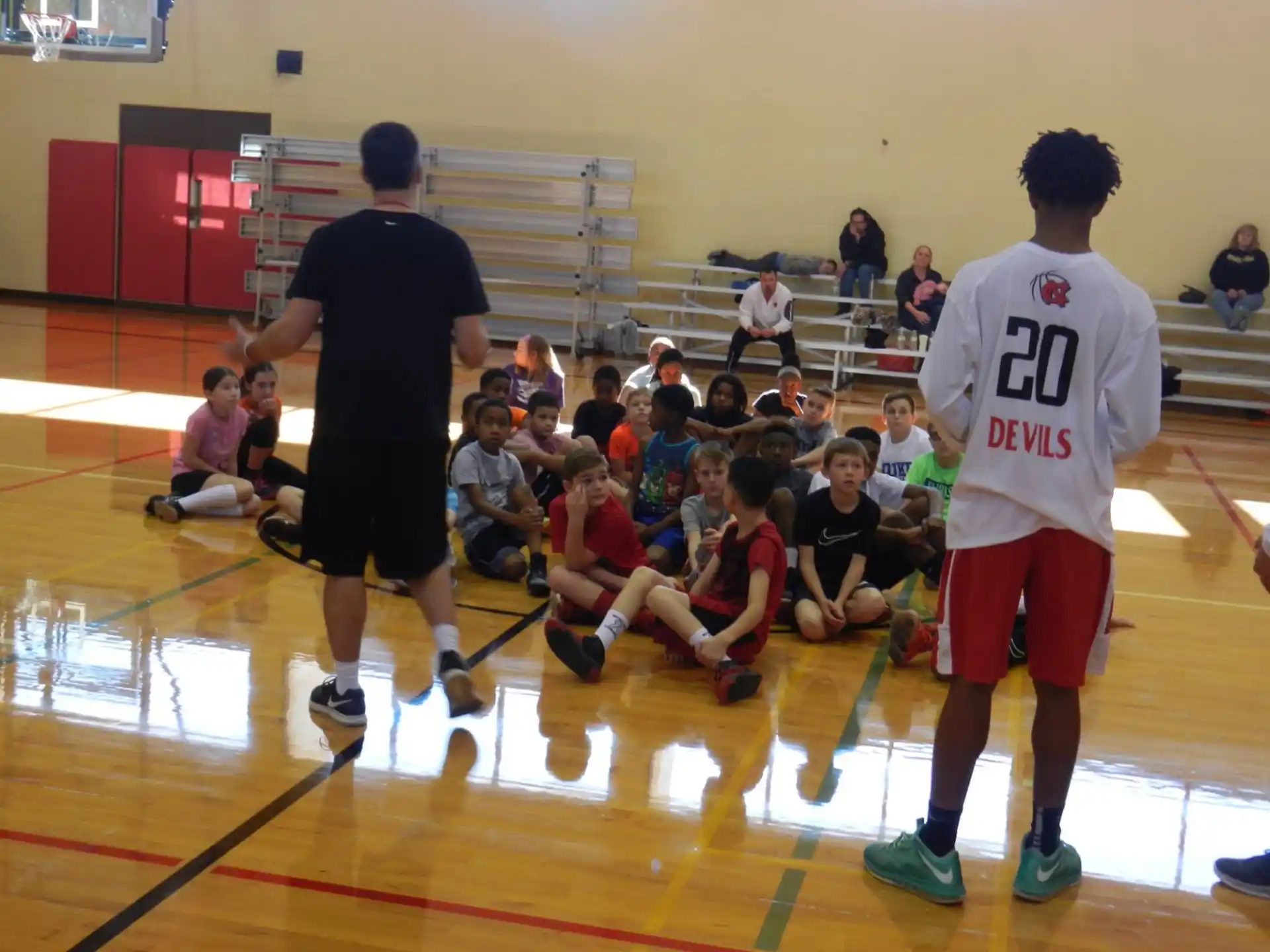 a group of people playing basketball