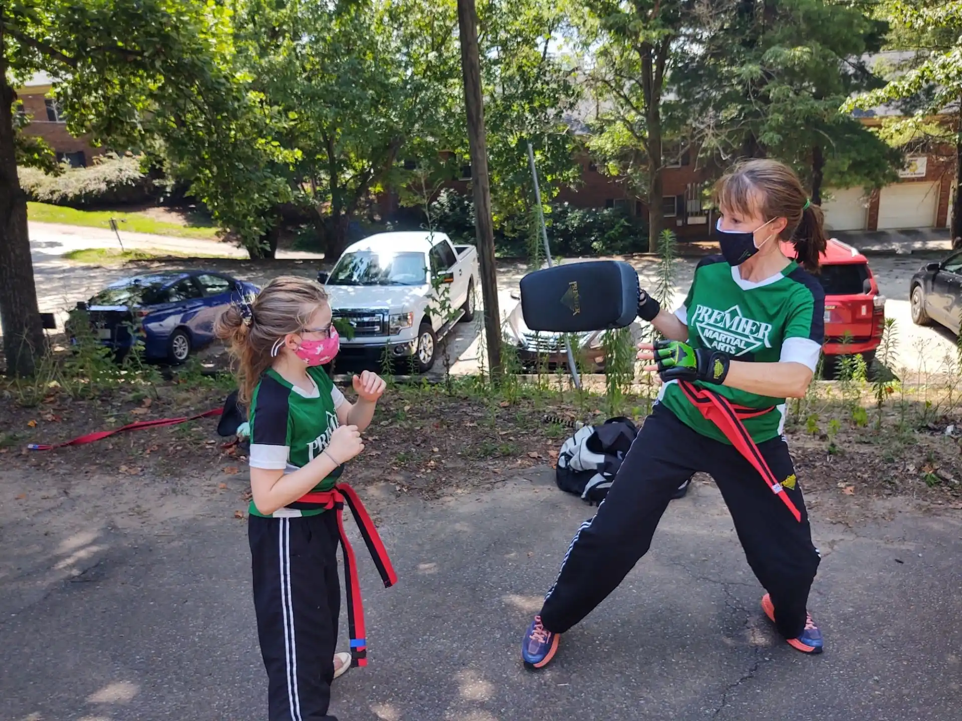 a group of people wearing masks and holding bows and arrows