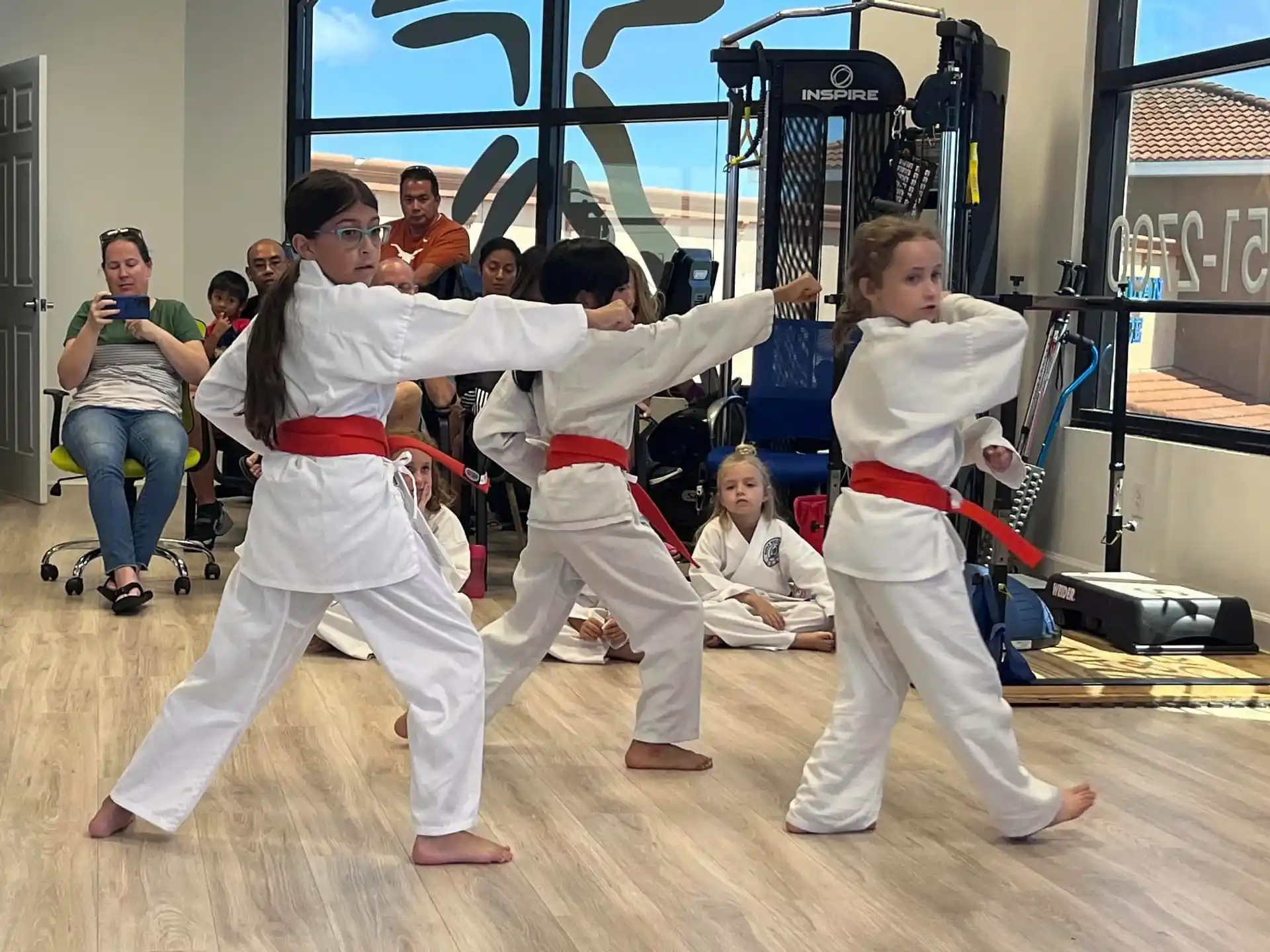 a group of people in karate uniforms