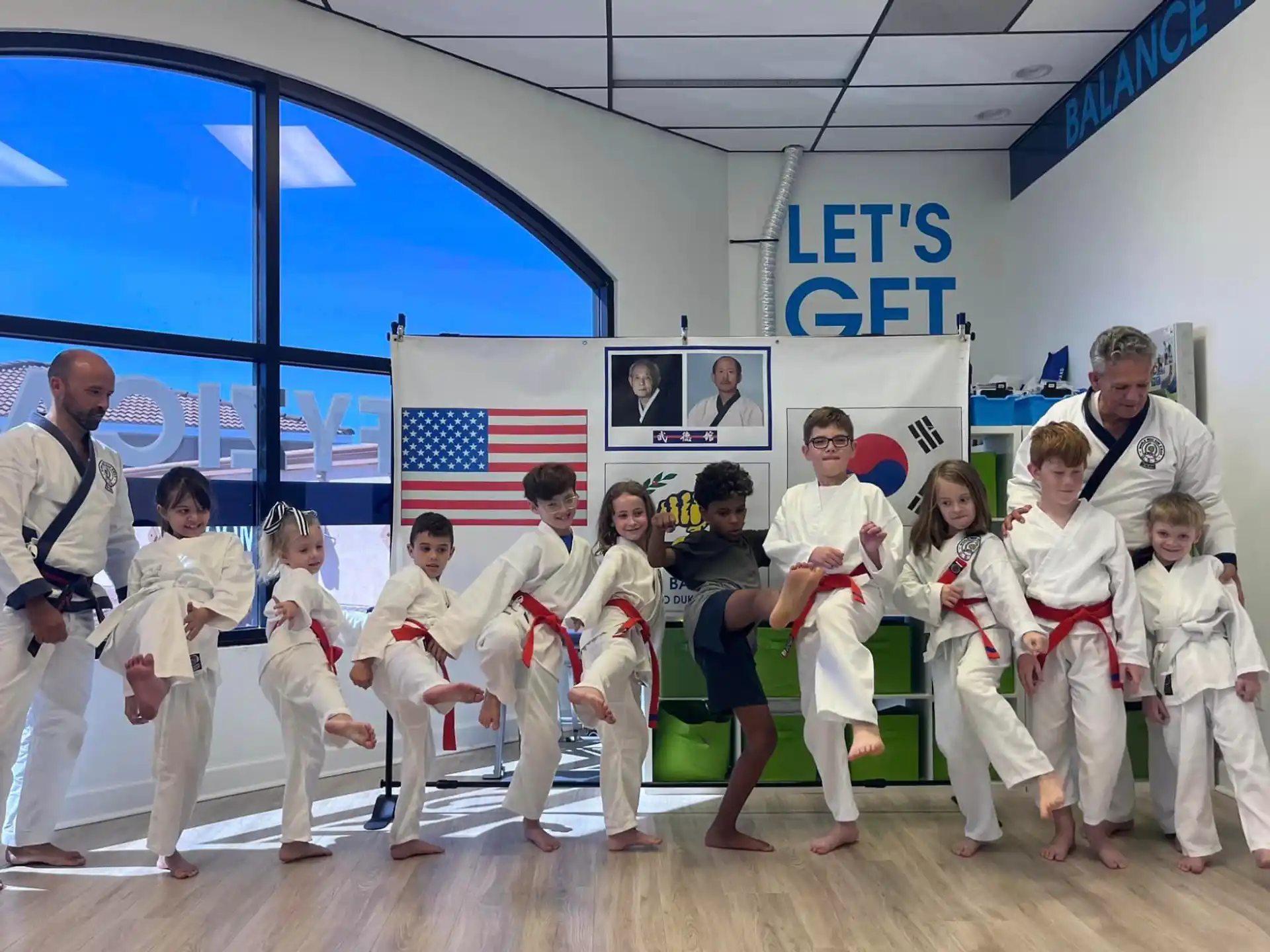 a group of people in karate uniforms