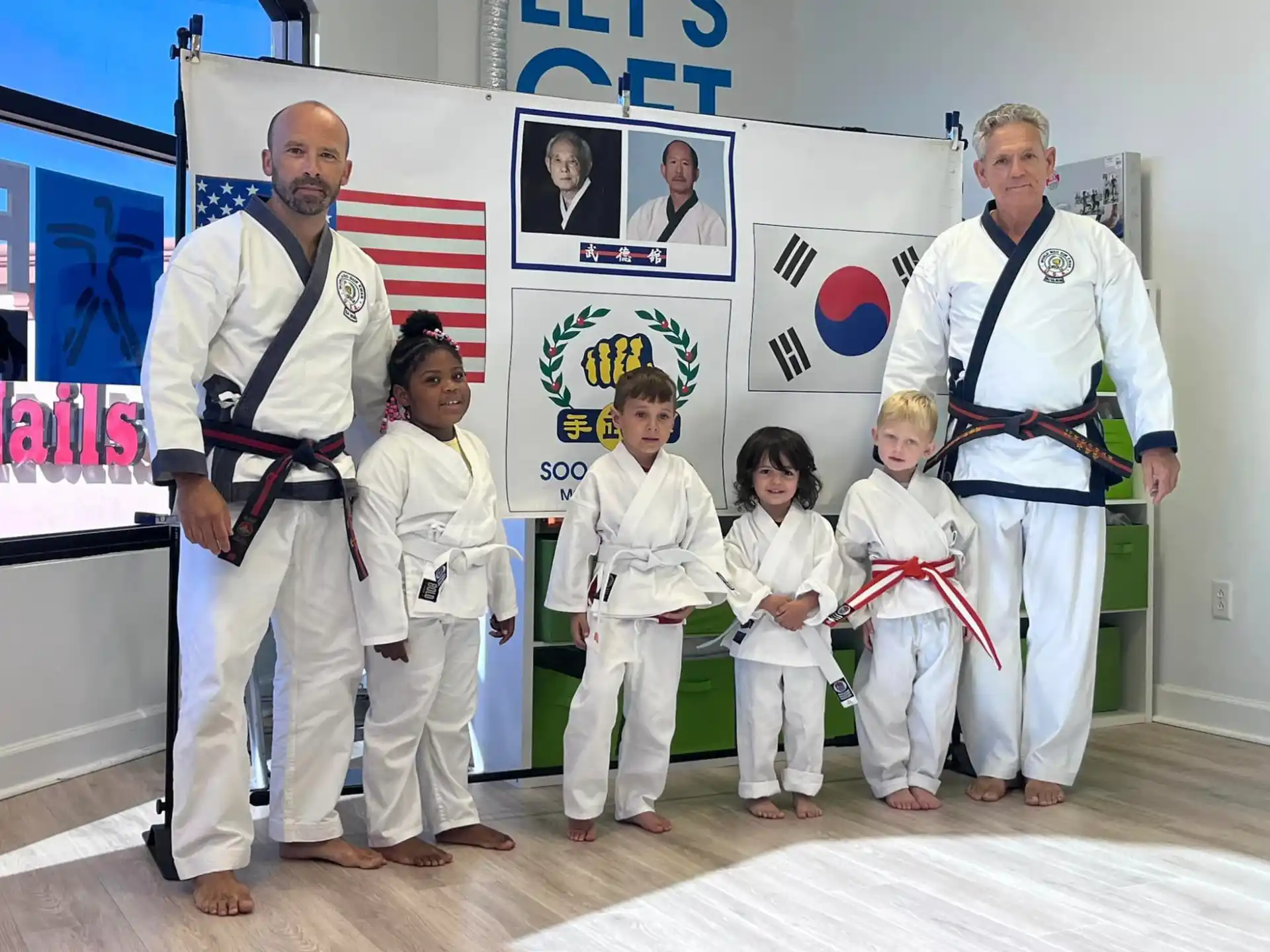 a group of people in karate uniforms