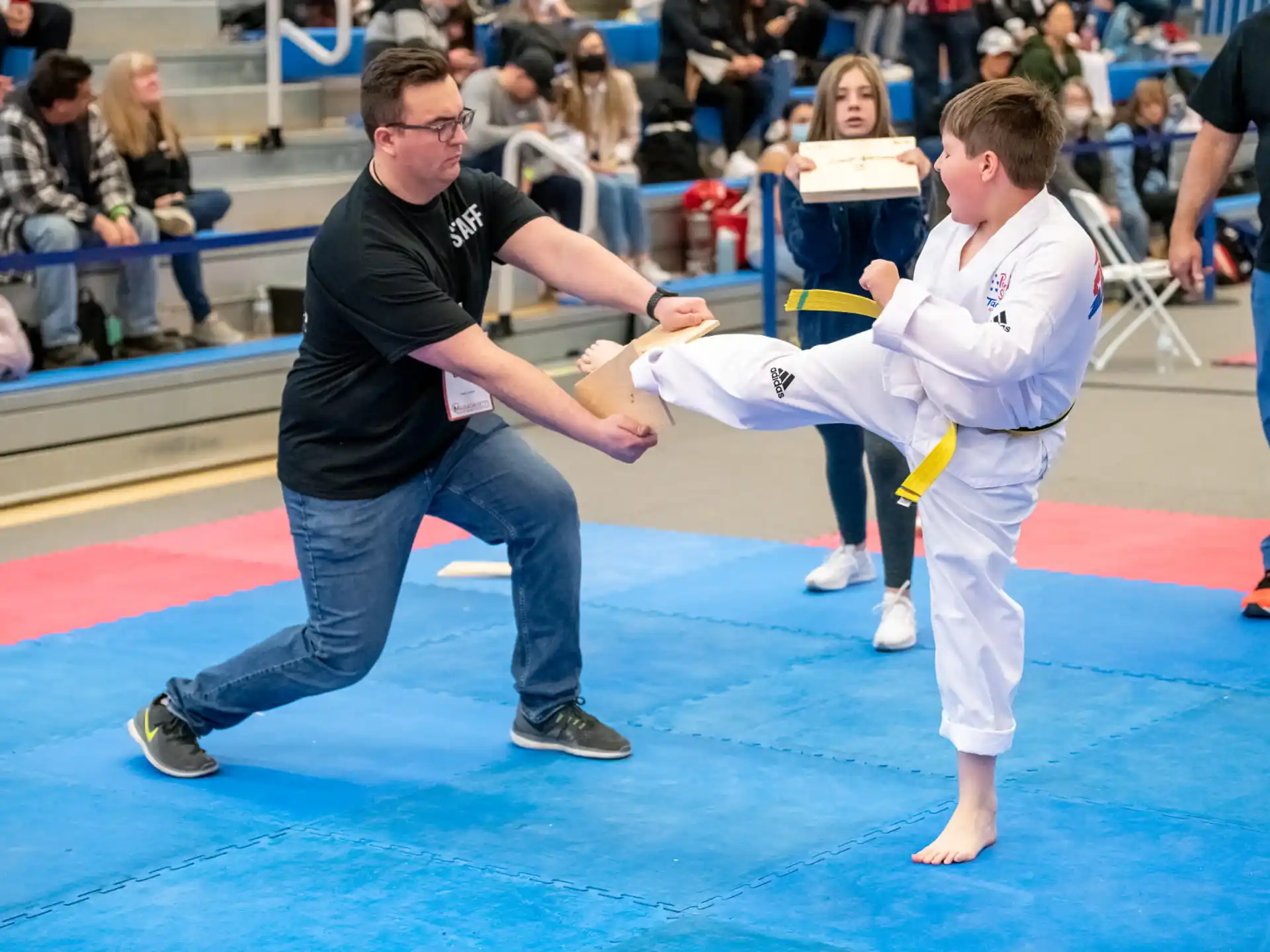 a person and a boy in karate uniforms