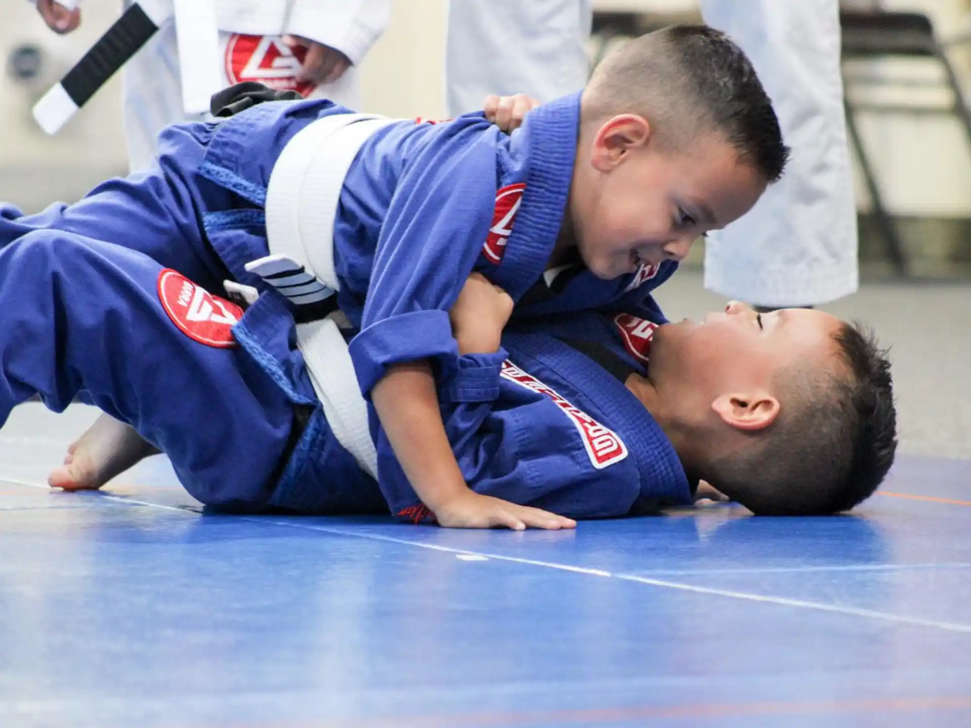a couple of boys wrestling