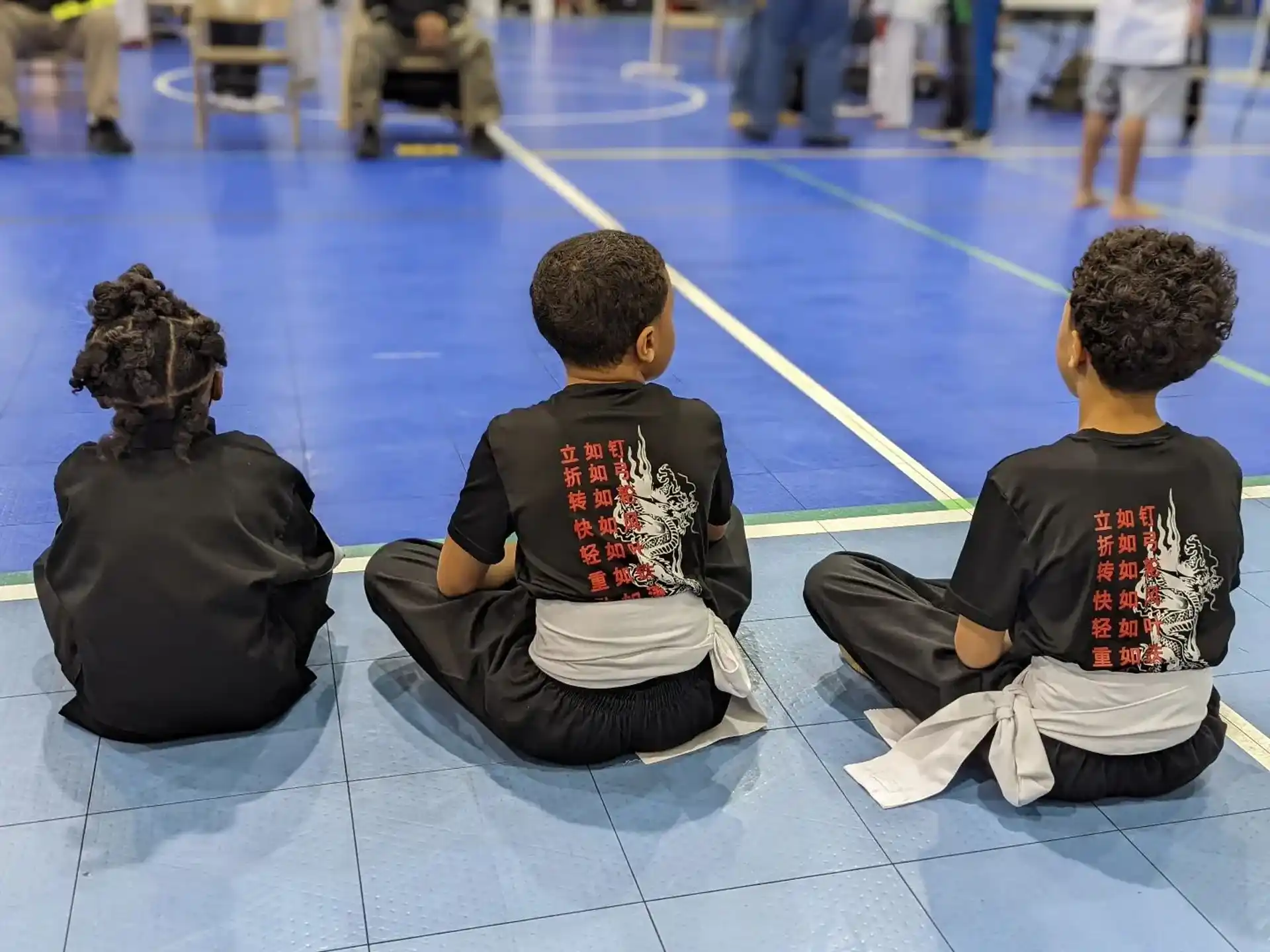 a few children sitting on the floor