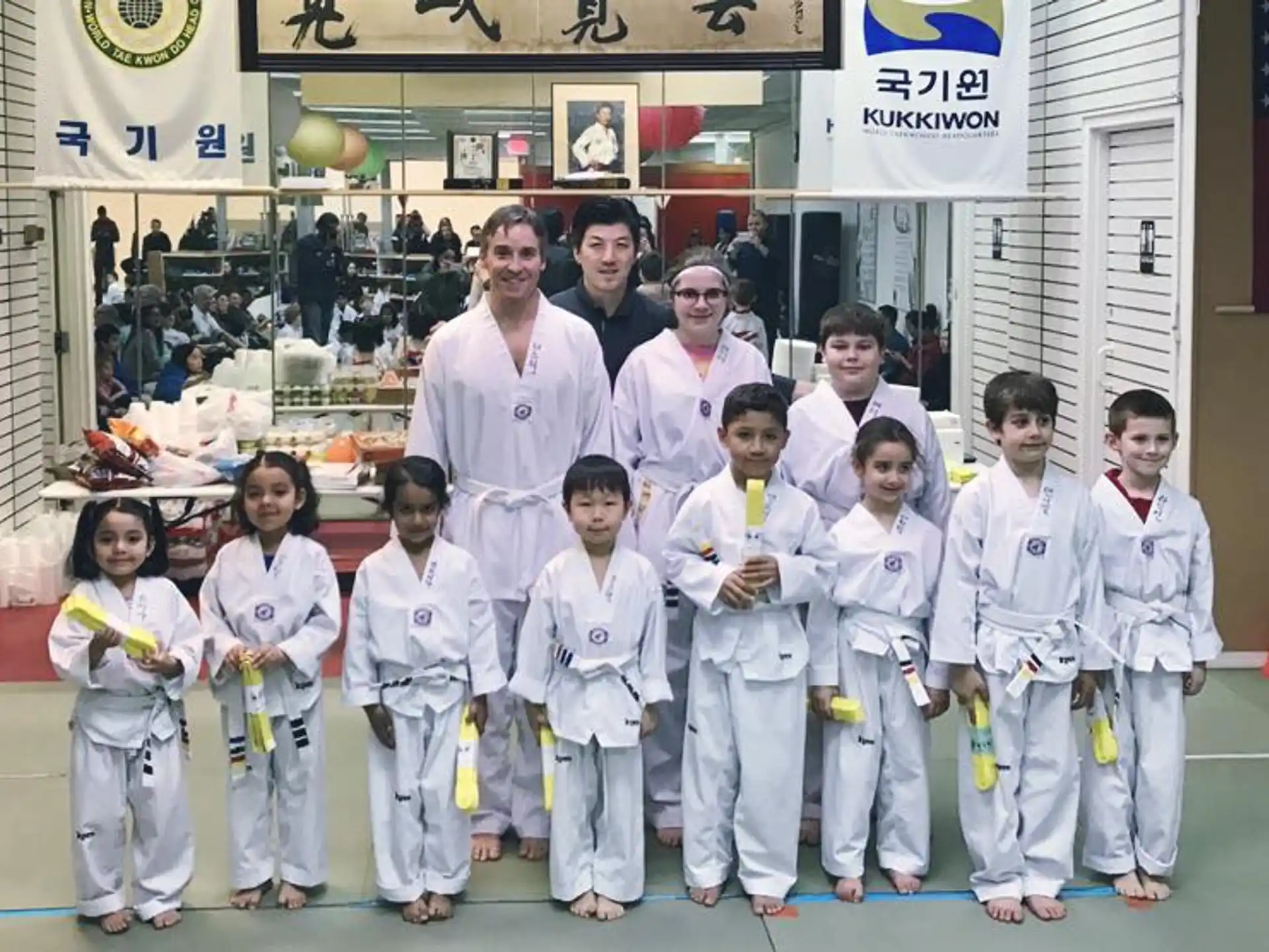a group of people in karate uniforms