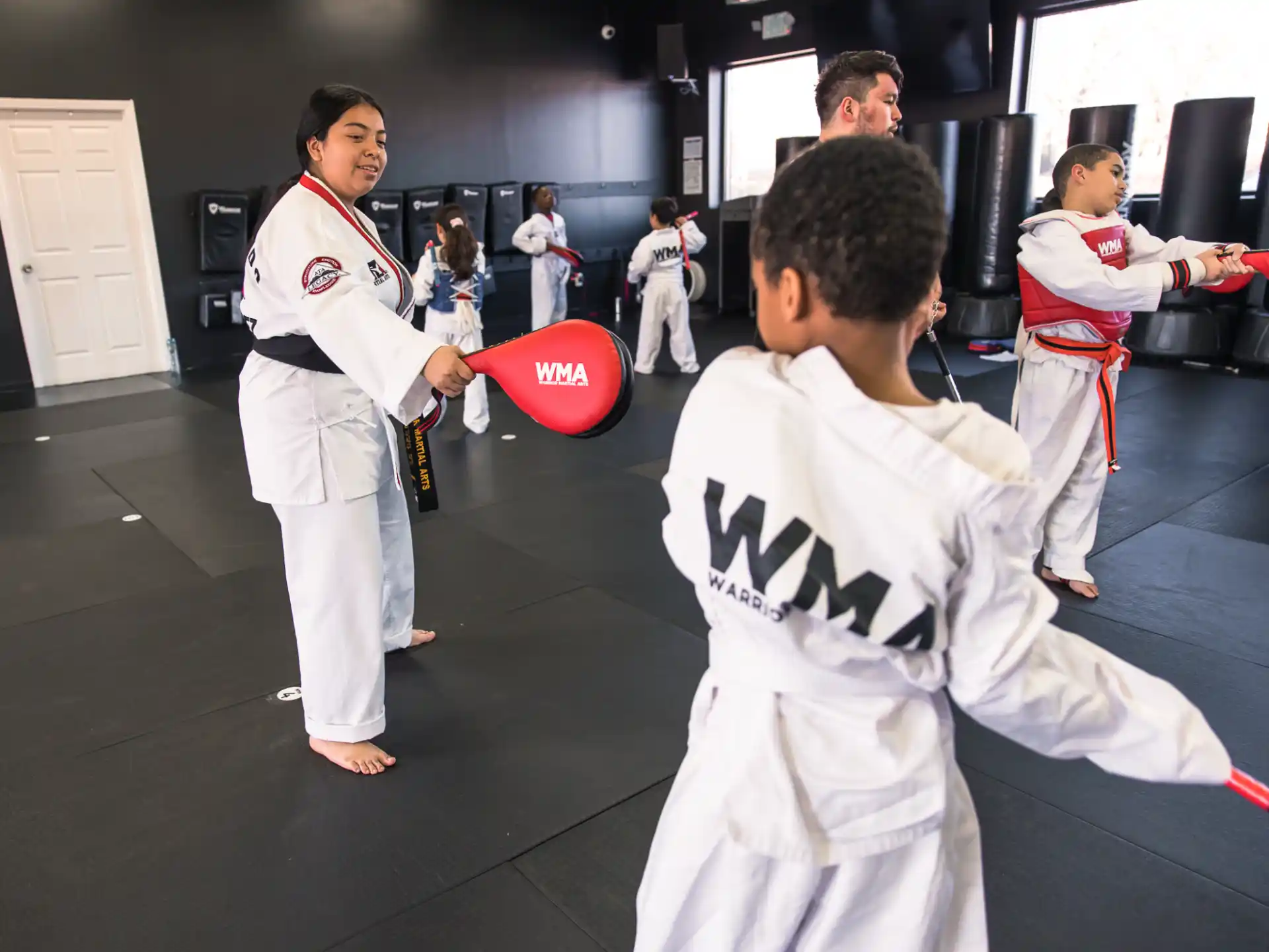 a group of people in karate uniforms