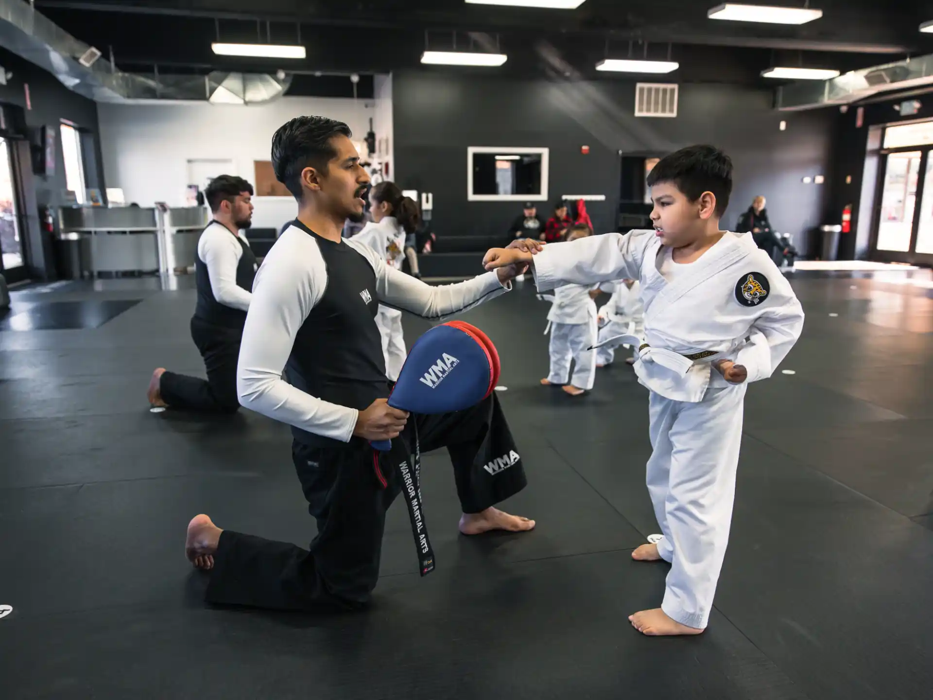 a group of people in karate uniforms
