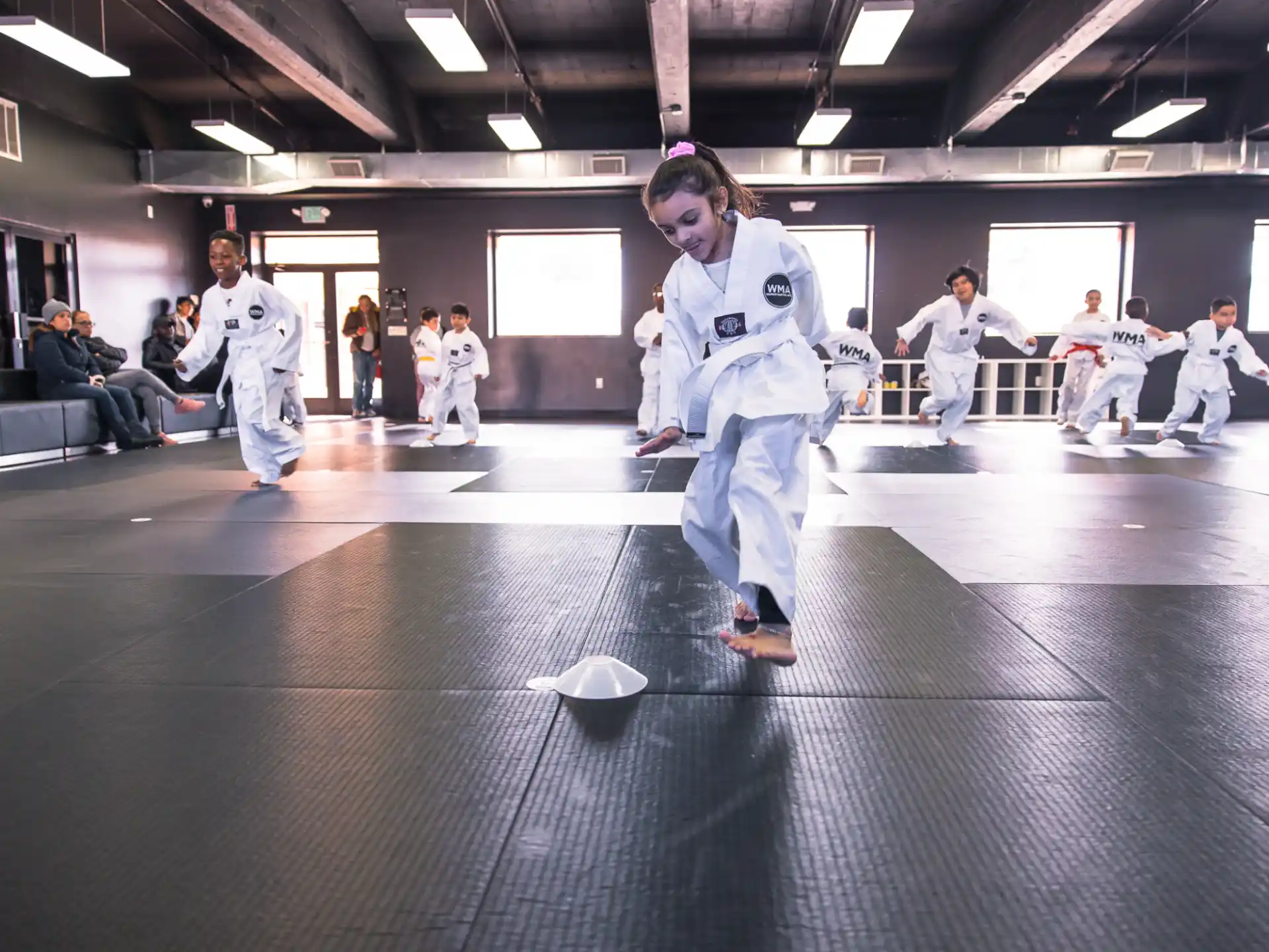 a group of people in karate uniforms