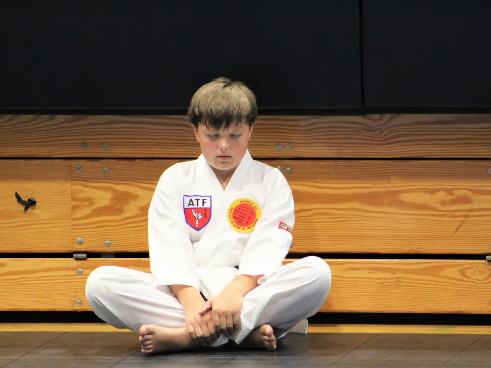 a boy sitting on the floor
