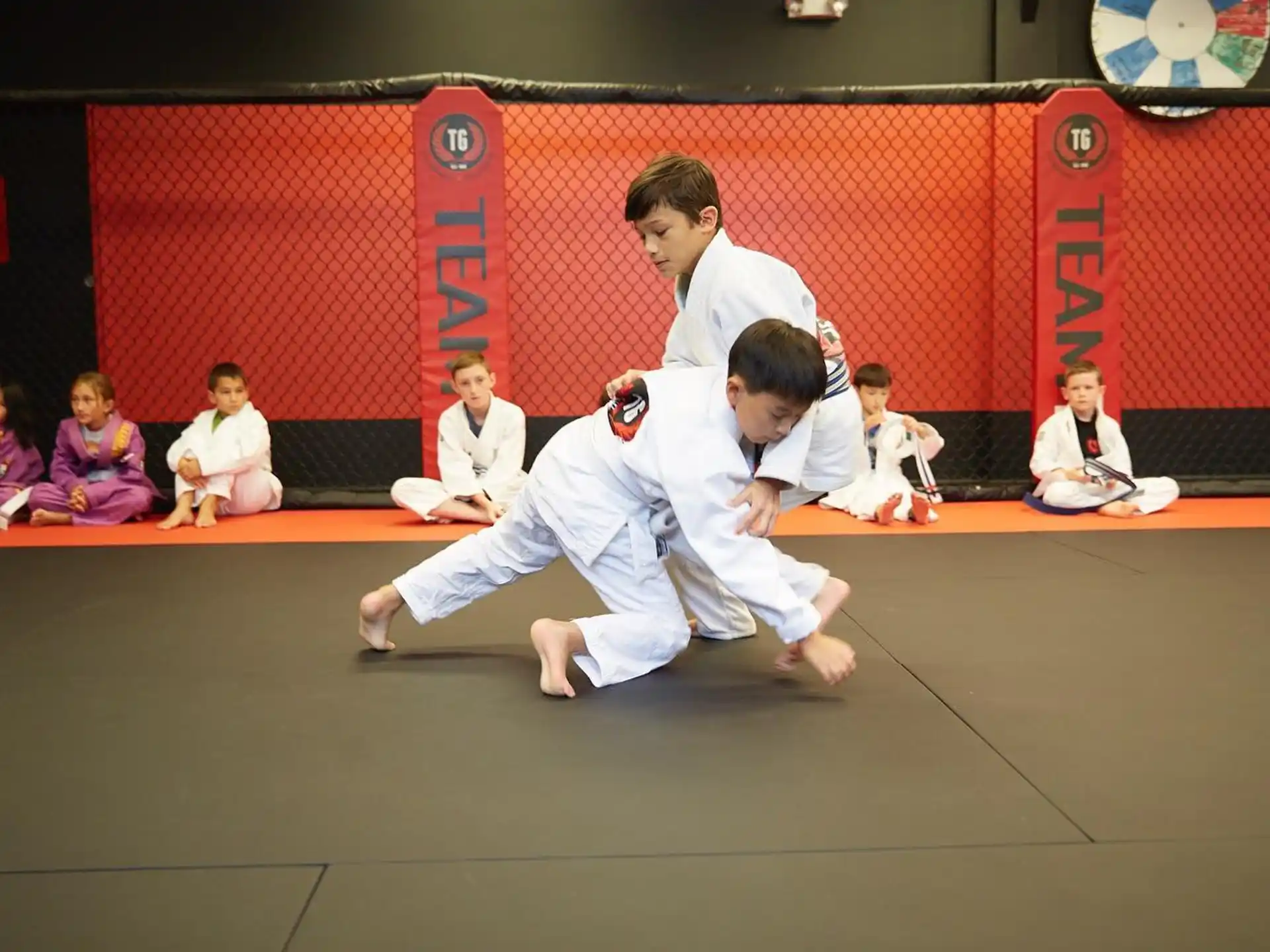a group of people in karate uniforms