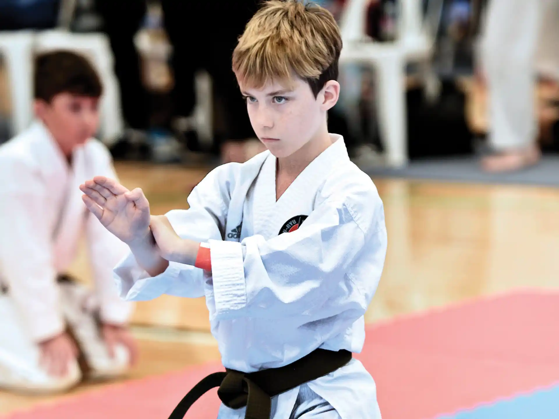 a boy in karate uniform